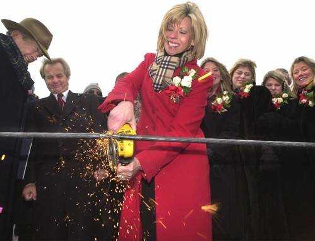 Rep. Jo Ann Emerson, R-Mo., cuts the ceremonial cable to officially open the Bill Emerson Memorial Bridge in Cape Girardeau. Mo., Saturday, Dec. 13, 2003.