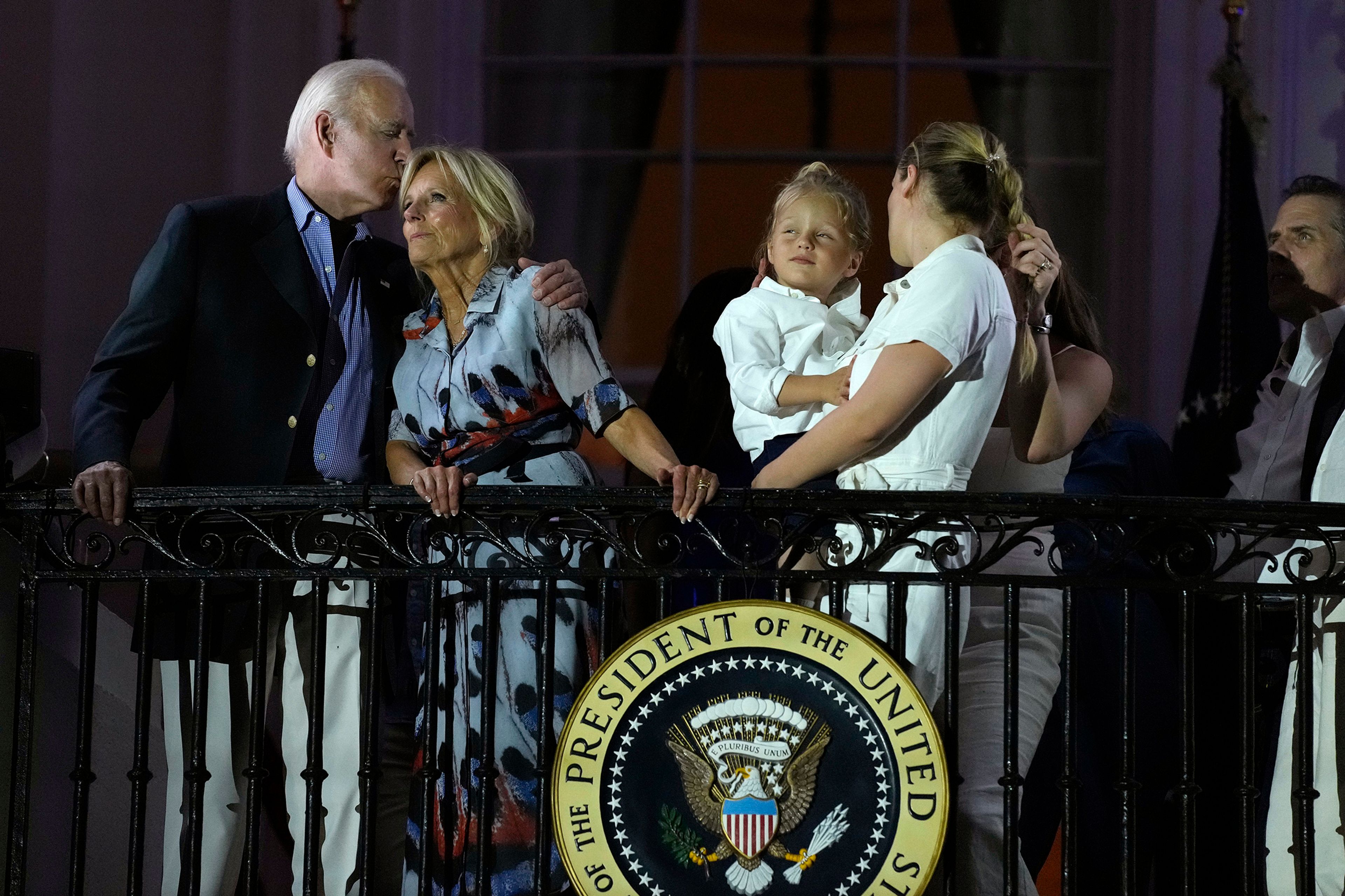 President Joe Biden kisses first lady Jill Biden during a fireworks show at a Fourth of July celebration at the White House in Washington, Tuesday, July 4, 2023.