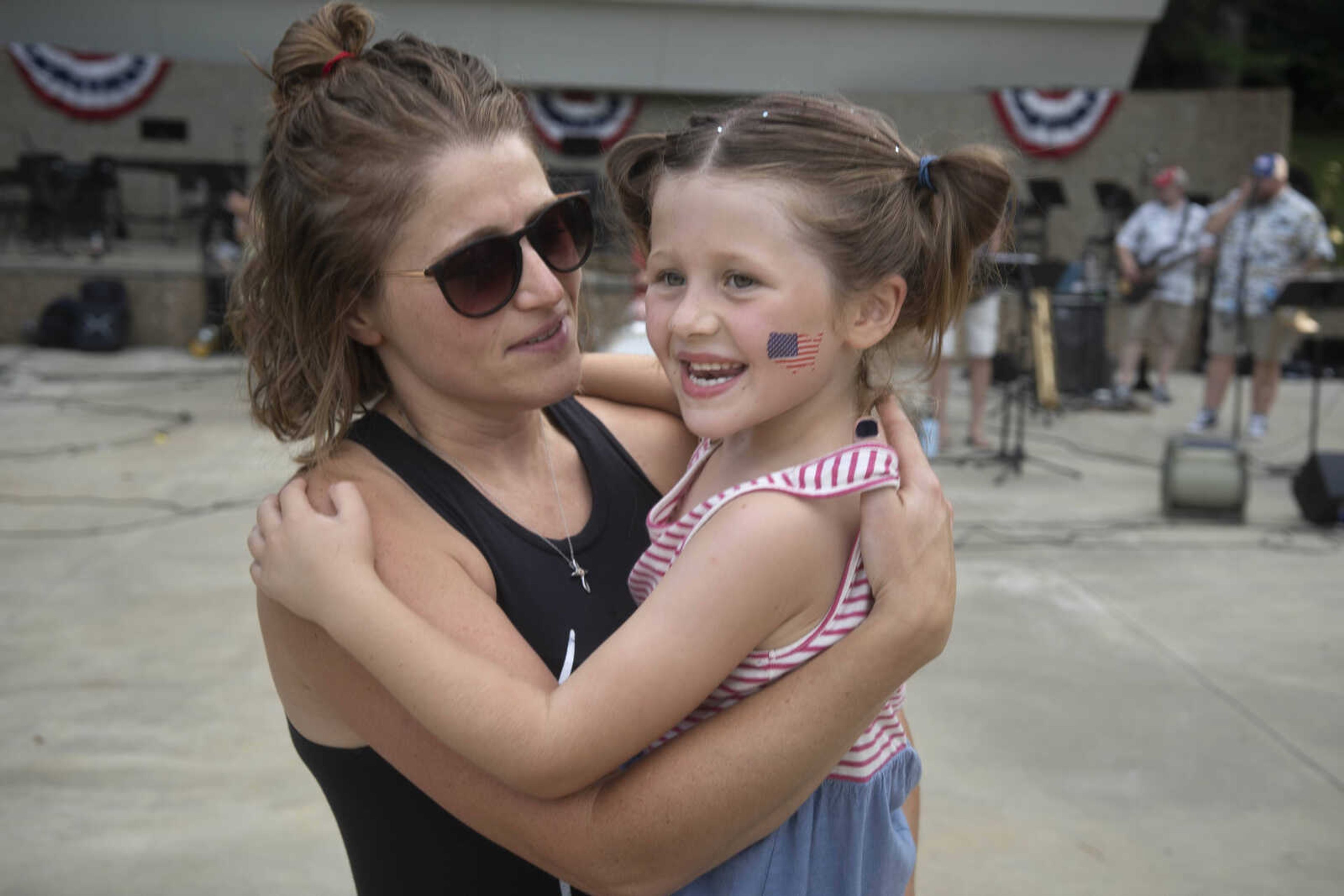 Rebecca Bucher, left, dances with her 6-year-old daughter, Averie Bruce, during an Independence Day celebration at the Jackson Municipal Band Shell.