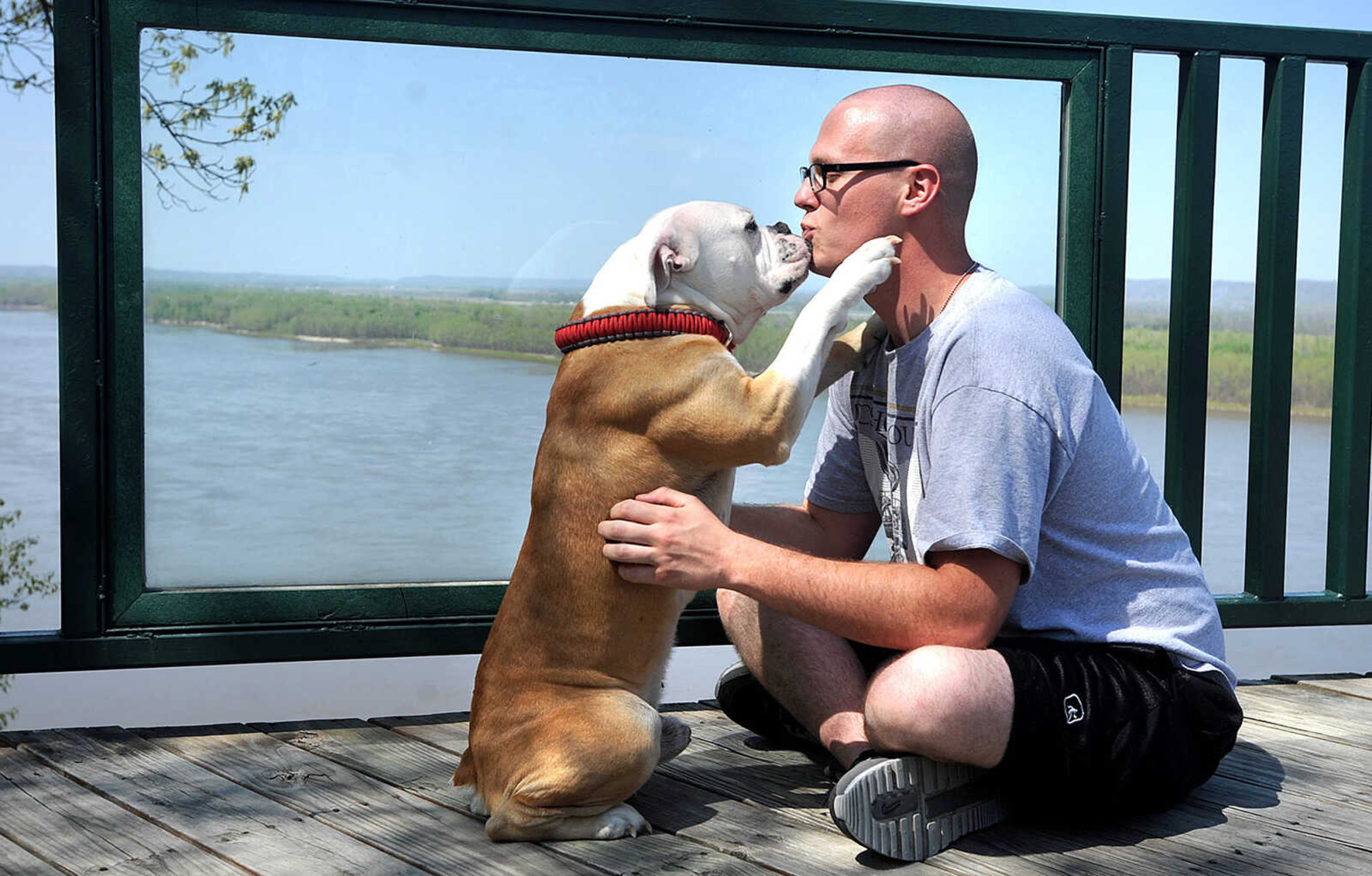 LAURA SIMON ~ lsimon@semissourian.com

Ronnie Thomas gets a kiss from his Old English Bulldog, Meatball, at the scenic Mississippi River overlook at Trail of Tears State Park, Wednesday, April 23, 2014. Thomas, his girlfriend Kera DeClue and Meatball were spending their day off together at the park. The park is one of many stops along this weekend's Mississippi River Valley Scenic Drive.