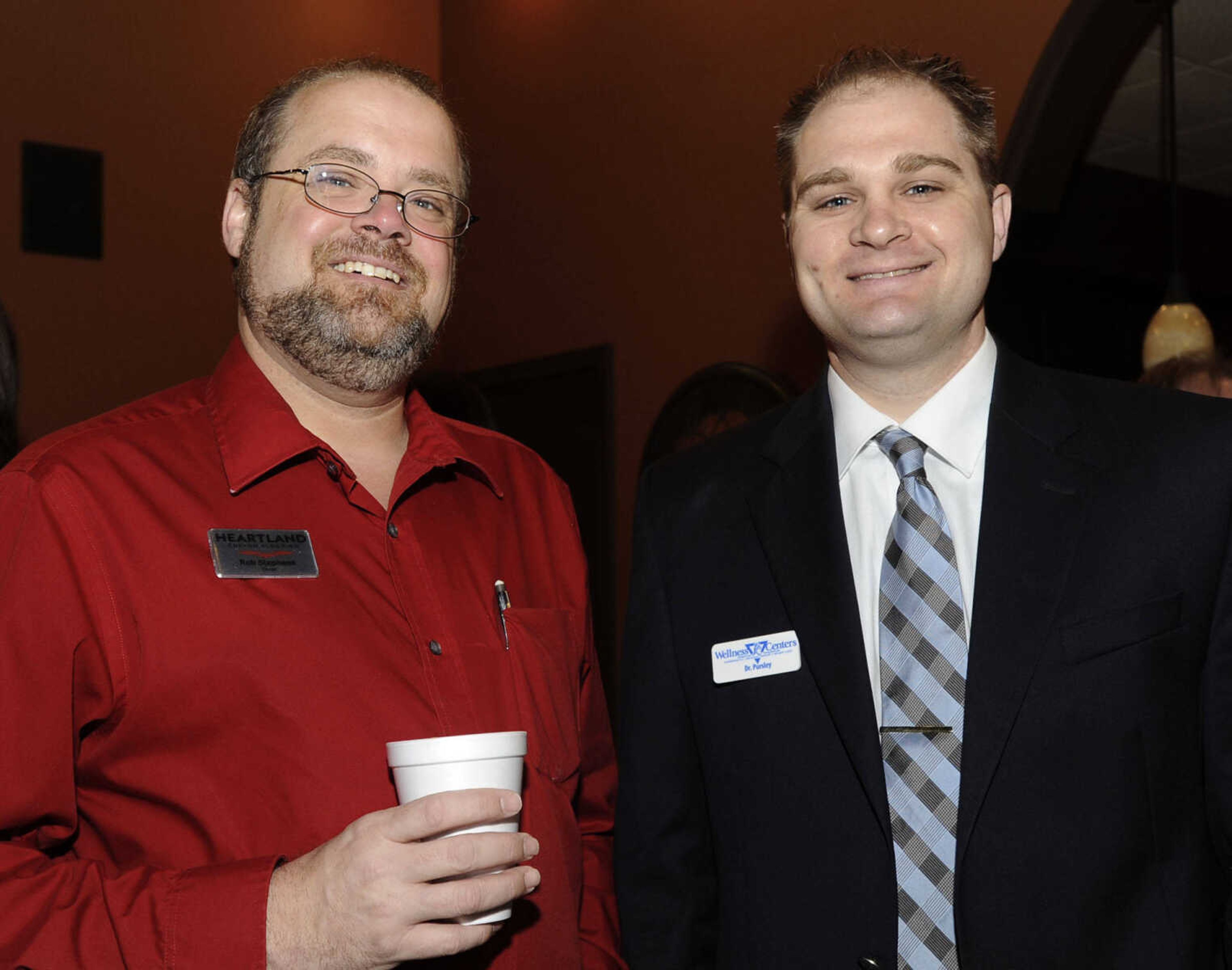 Rob Stephens, left, with Heartland Custon Flooring, and Dr. Gregory Pursley with with PC Wellness Centers.