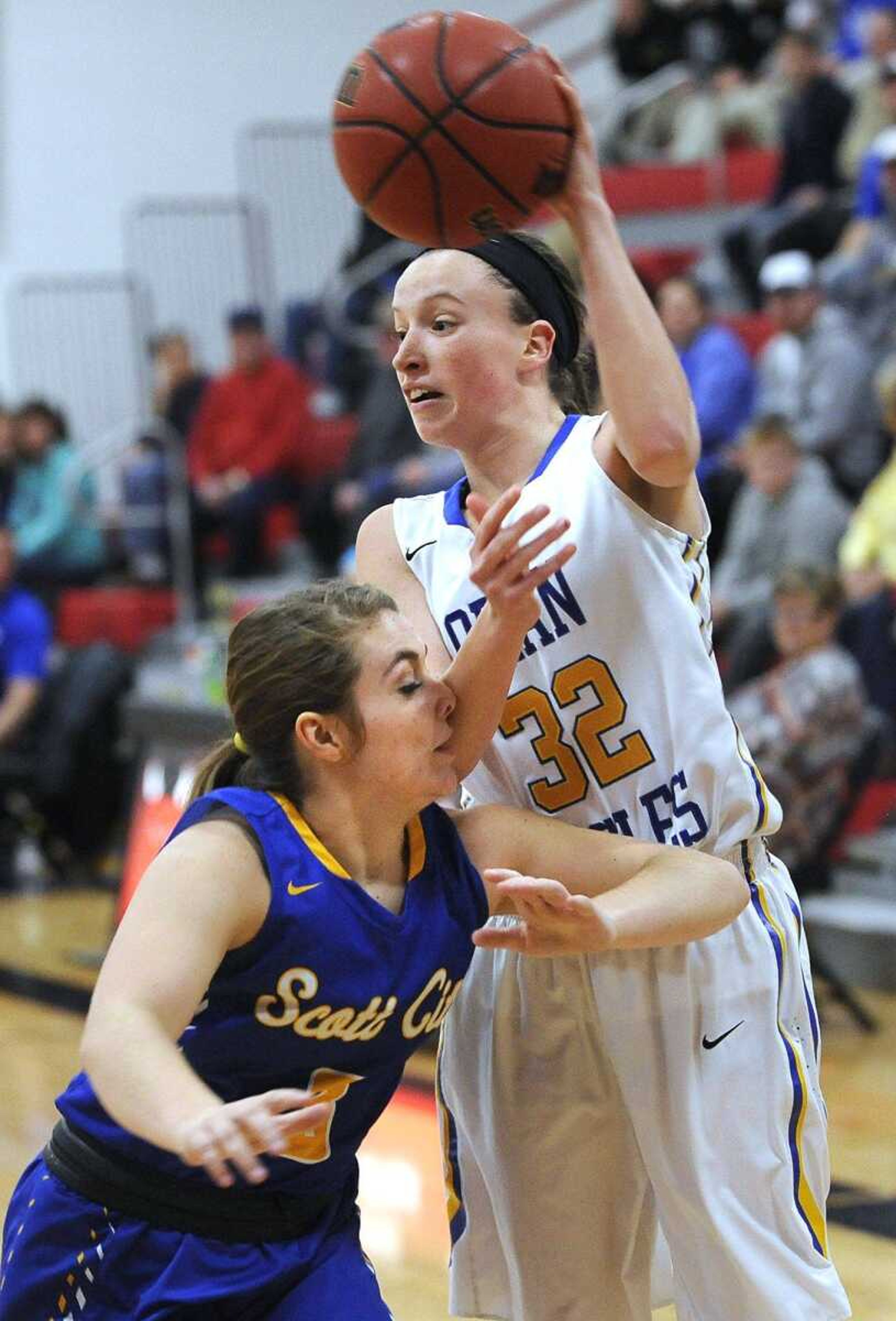 Oran's Leah Cauble passes the ball over Scott City's Tori Buckner during a first-round game in the Scott-Mississippi Conference Tournament on Tuesday in Chaffee, Missouri.