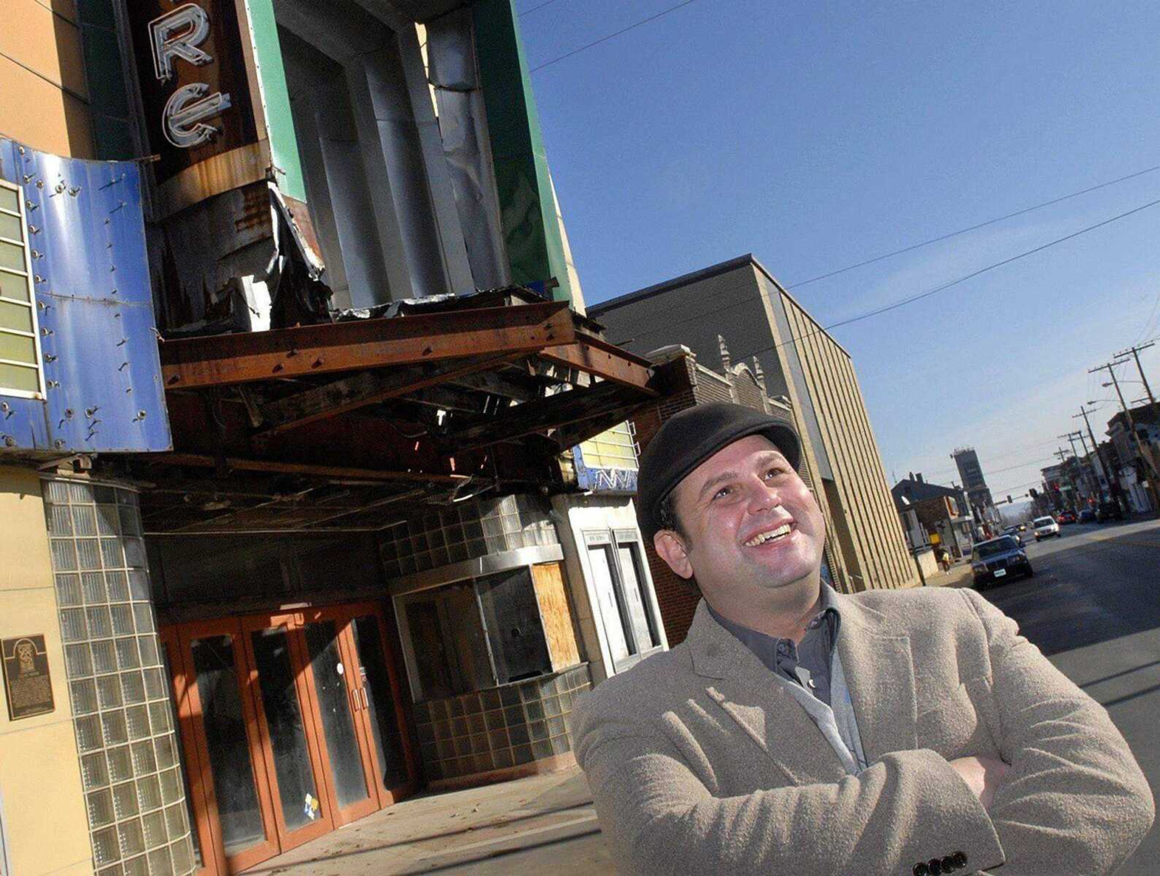 John Buckner stands next to the old Esquire Theater on Dec. 28, 2011, on Broadway in Cape Girardeau. (Laura Simon)