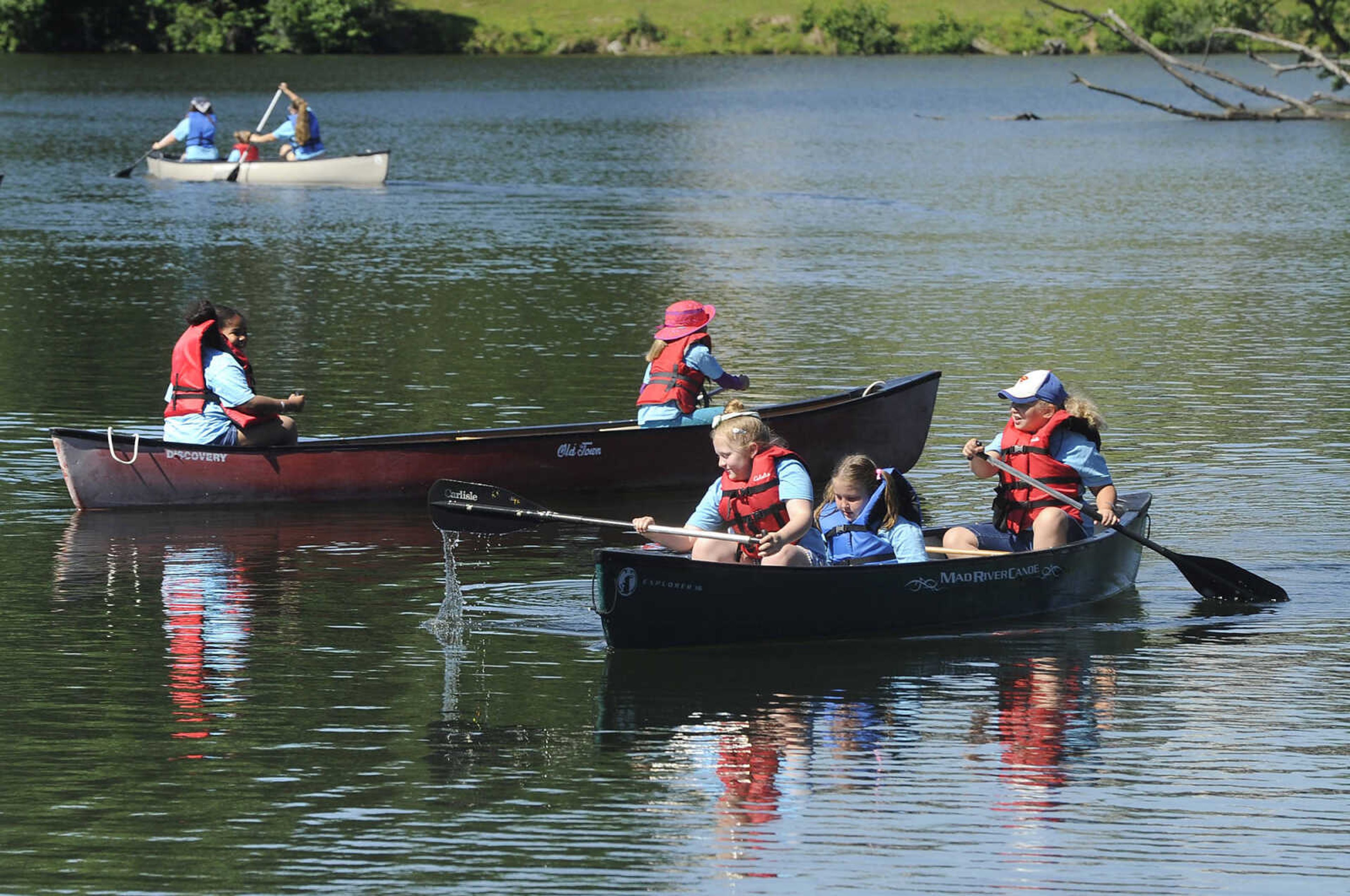 FRED LYNCH ~ flynch@semissourian.com
Brownie Girl Scouts paddle canoes Thursday, June 8, 2017 during Girl Scout day camp at Elks Lake in Cape Girardeau.