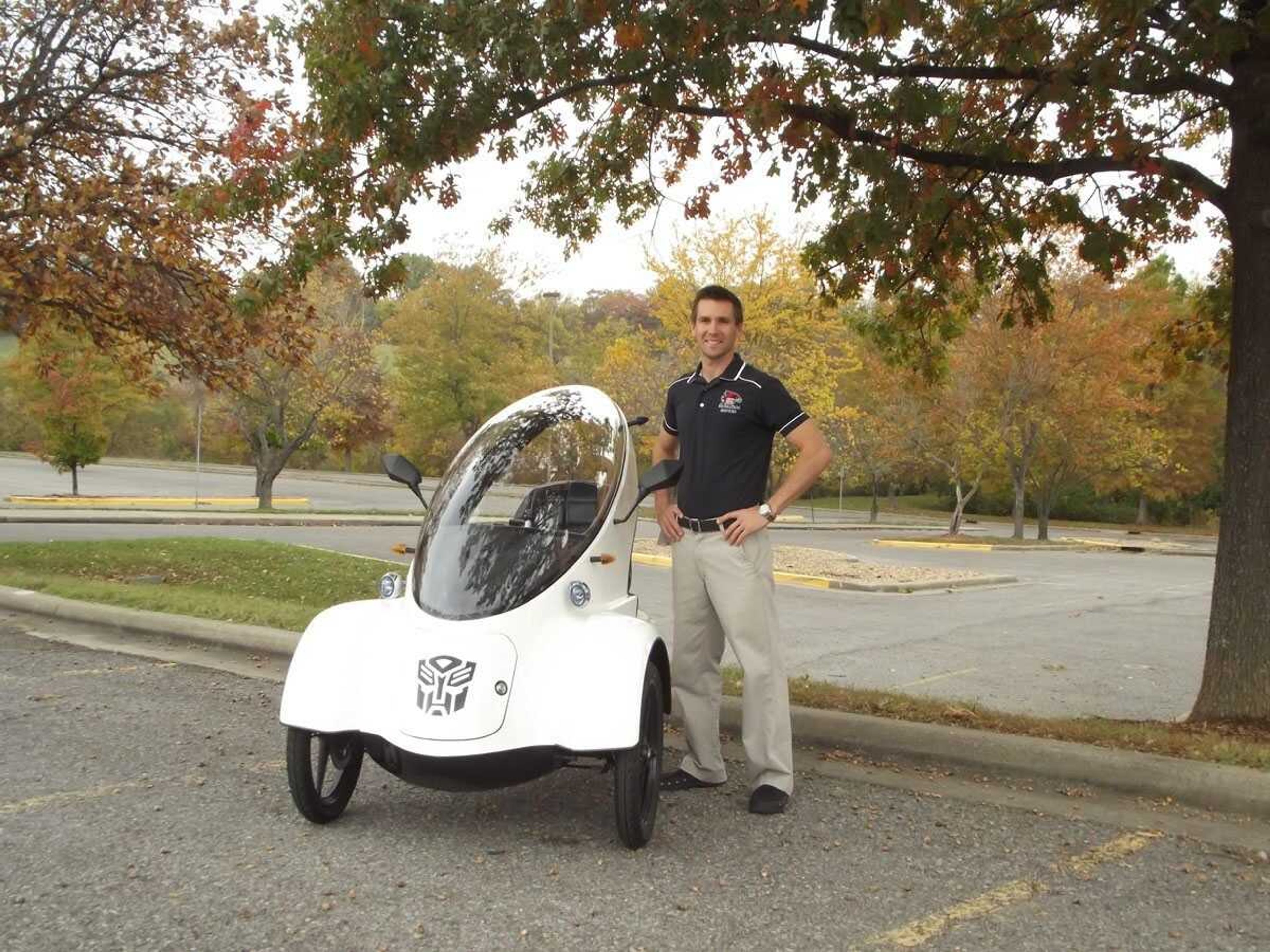 Chad Sierman stands next to his self-built electric car, the BugE. (Submitted photo)