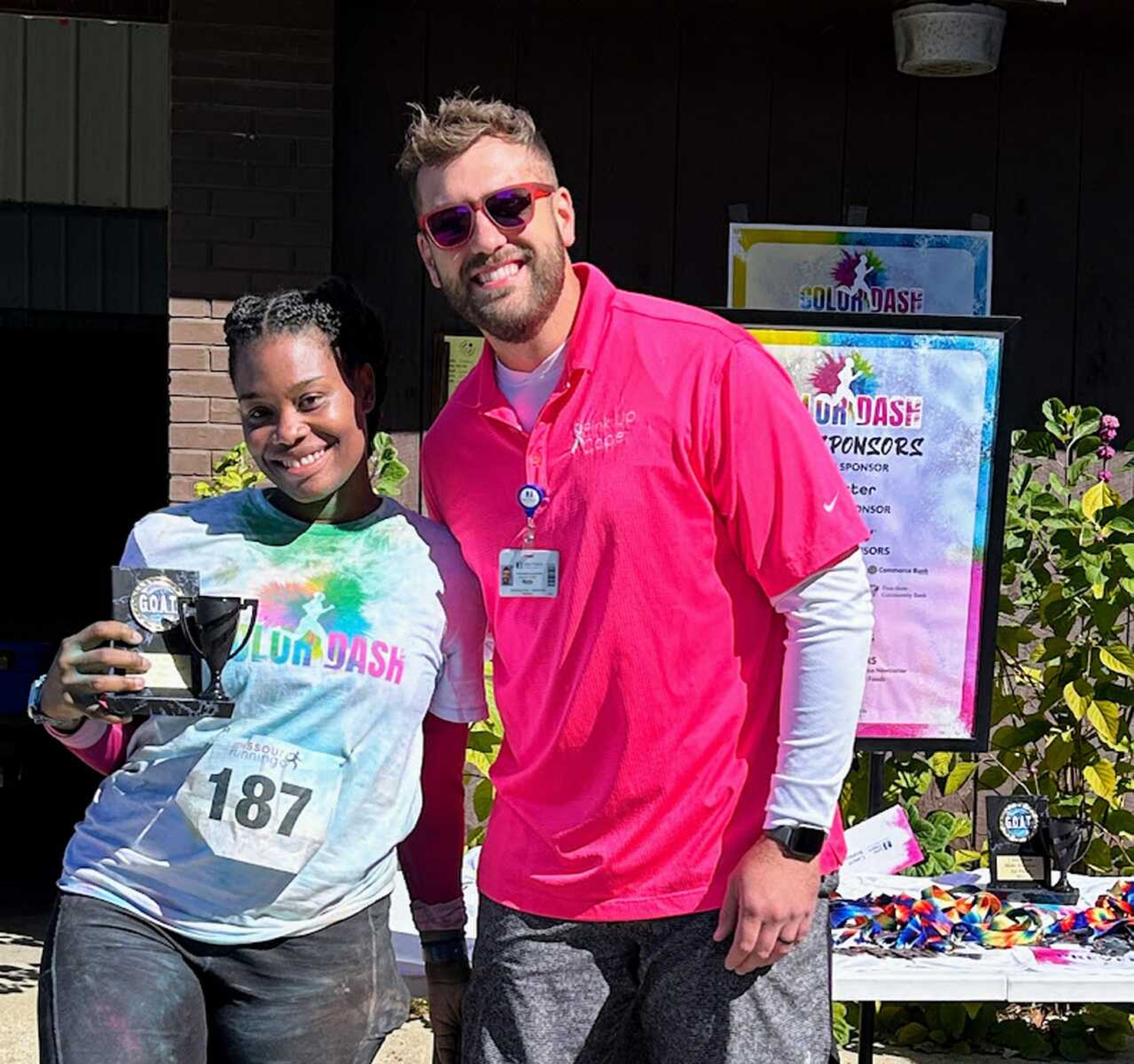 Runner and cancer survivor Delisal Cole, left, with Nathan Gautier of Saint Francis Foundation's Development Office at the fifth annual Color Dash 5K and Fun Walk on Saturday, Oct. 7, at Arena Park in Cape Girardeau. Cole was the overall survivor female winner during the dash, which raised money to provide free cancer screenings.