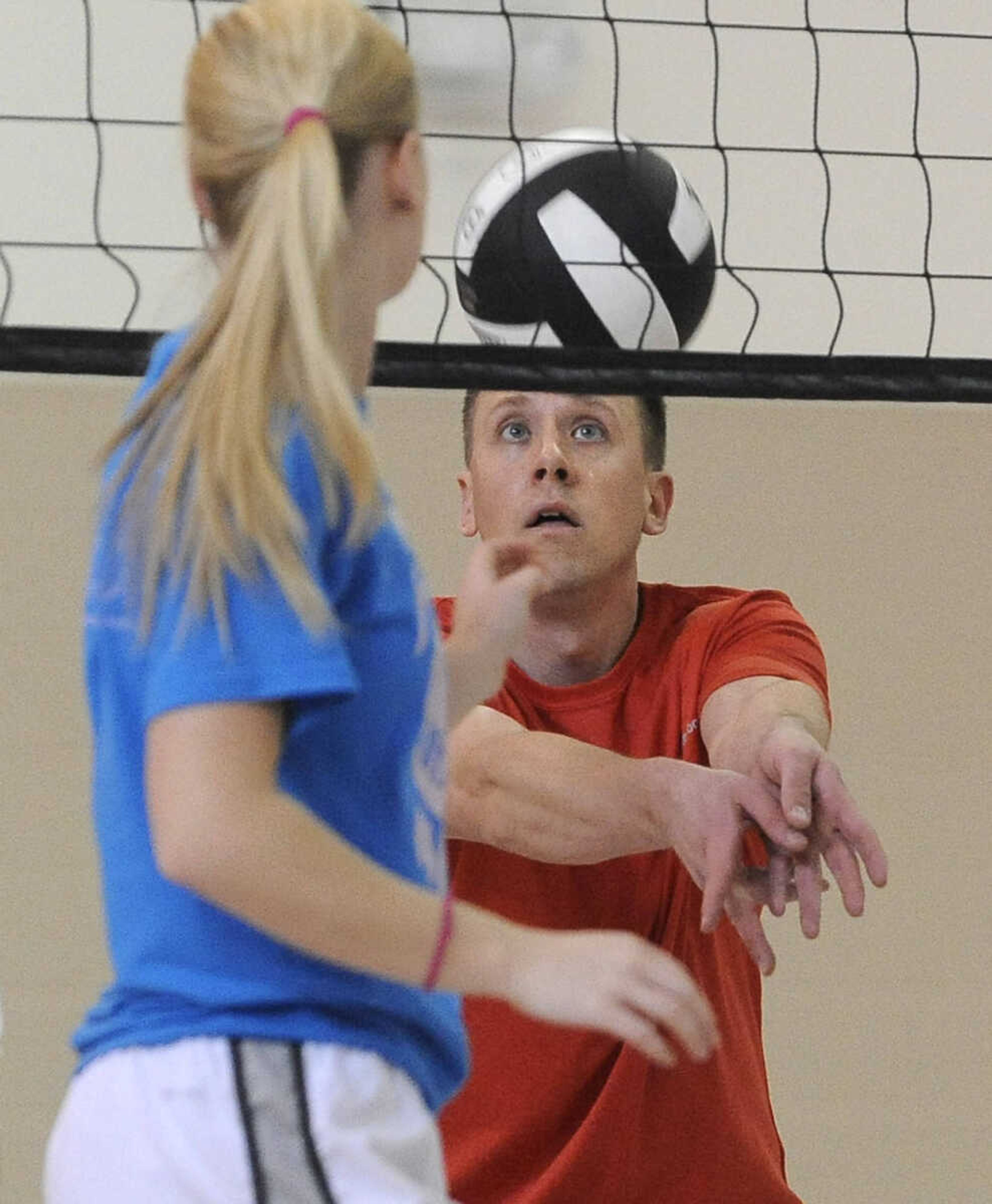 Brian Ulrich of the Mucho Remate team looks to set the ball in the Osage Invitational Co-ed Volleyball Tournament Sunday, March 1, 2015 at the Osage Centre.