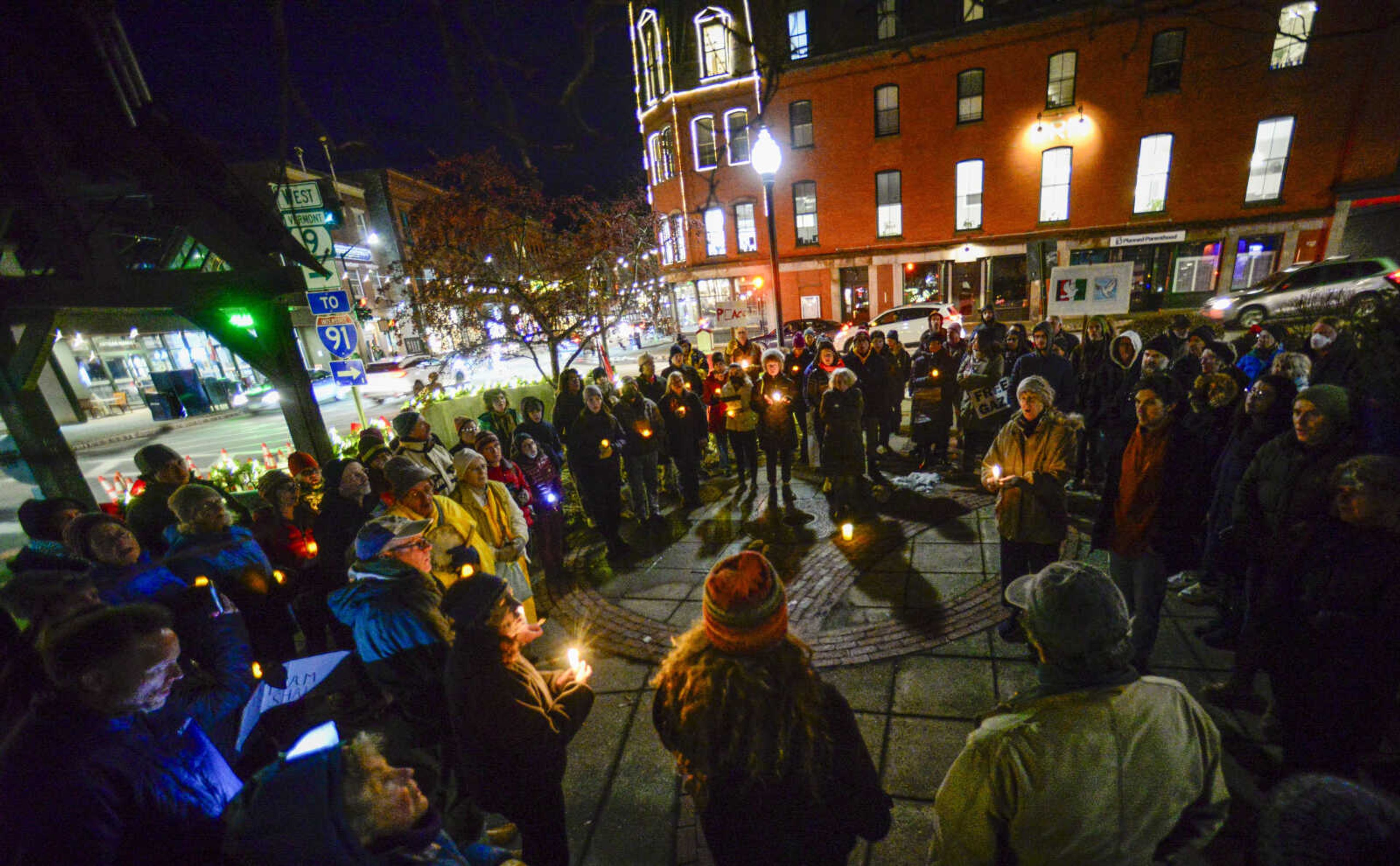 People gather Monday in Pliny Park in Brattleboro, Vermont, for a vigil for the three Palestinian-American students who were shot Saturday while walking near the University of Vermont campus in Burlington, Vermont. The three students were being treated at the University of Vermont Medical Center, and one faces a long recovery because of a spinal injury, a family member said.