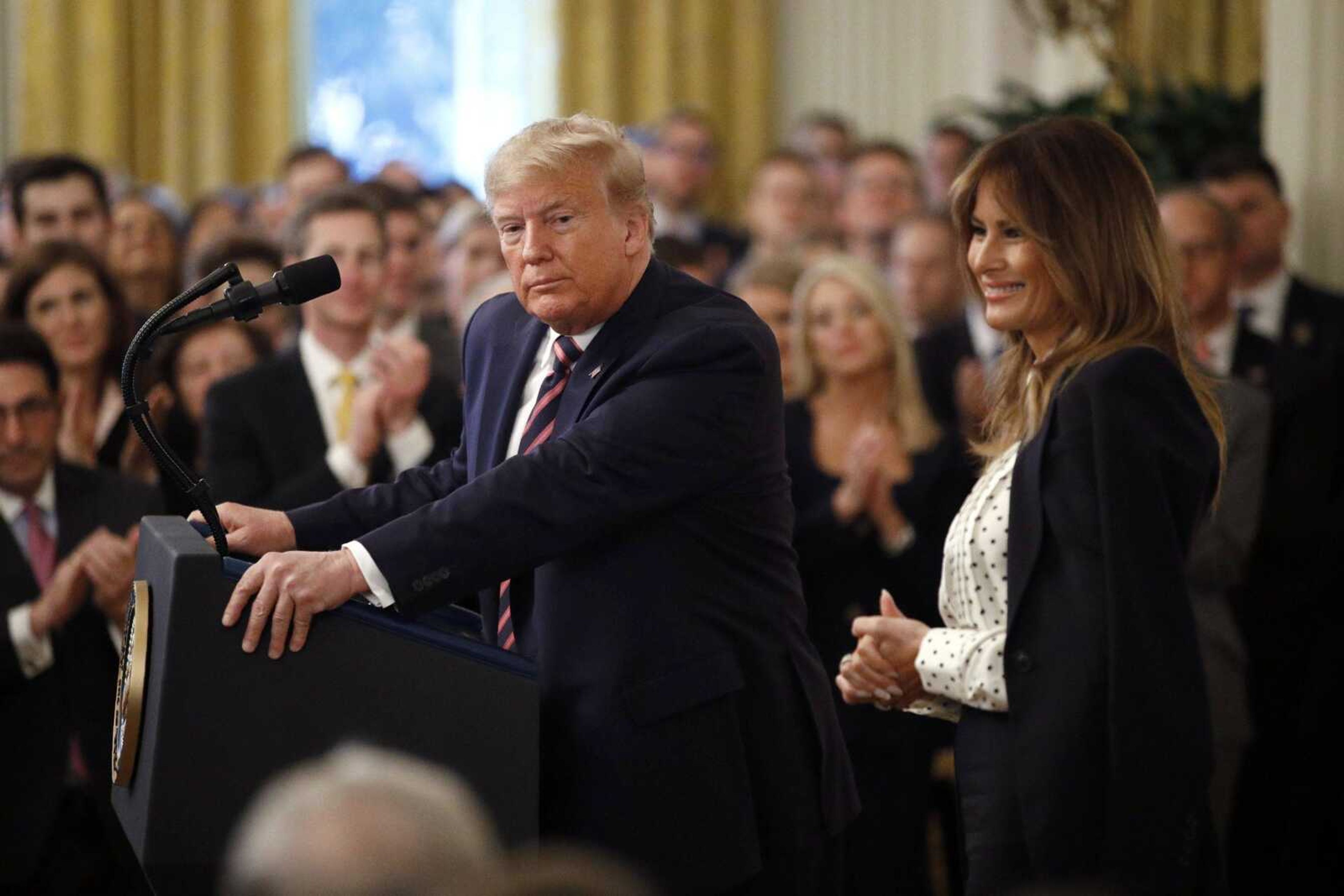 President Donald Trump pauses as he speaks alongside first lady Melania Trump in the East Room of the White House in Washington, Thursday, Feb. 6, 2020. (AP Photo/Patrick Semansky)