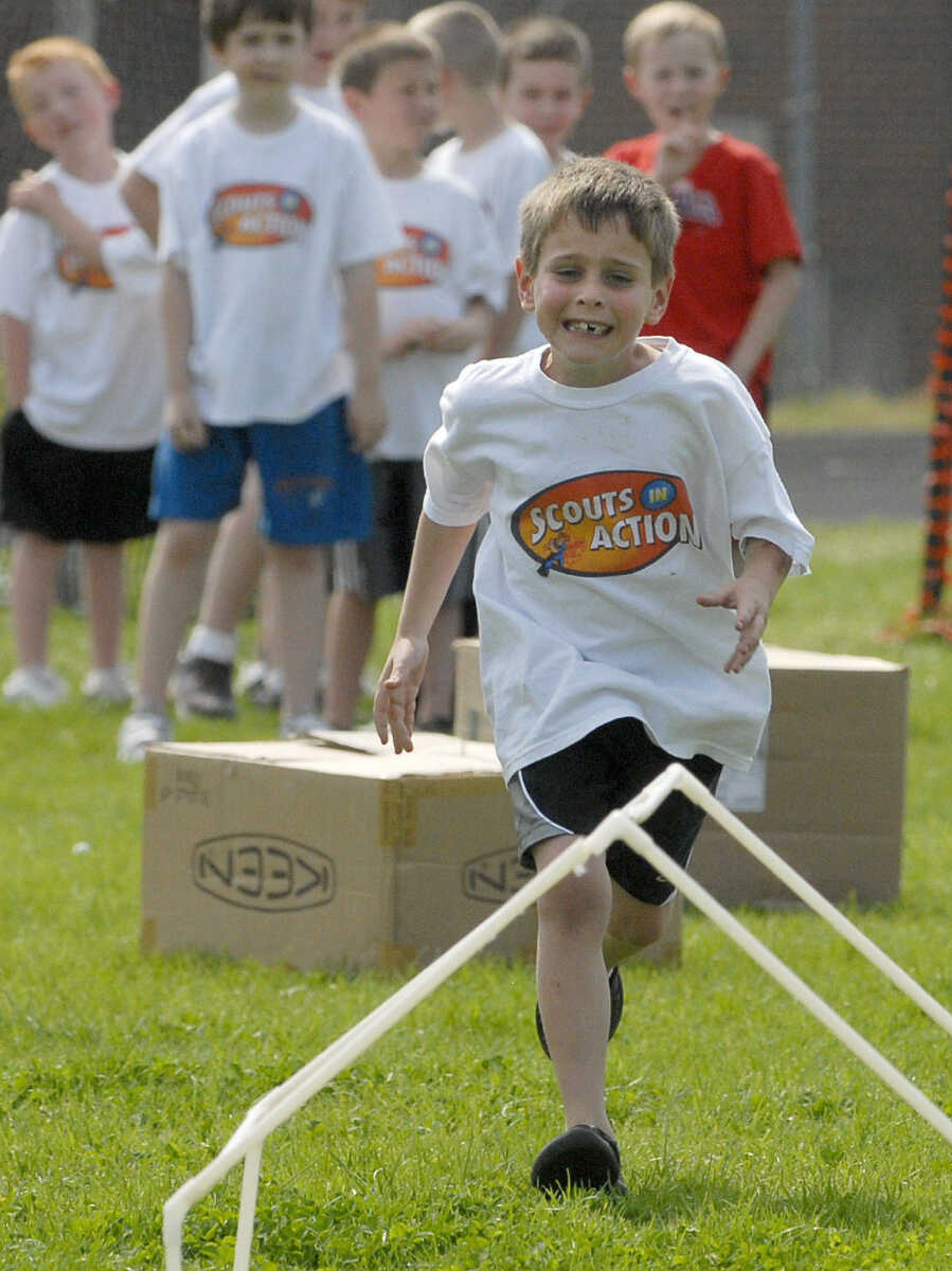 LAURA SIMON~lsimon@semissourian.com
Connor Moore attacks the obstacle course Sunday, April 10, 2011 during the Cub Scout track and field day at Cape Central Junior High in Cape Girardeau.