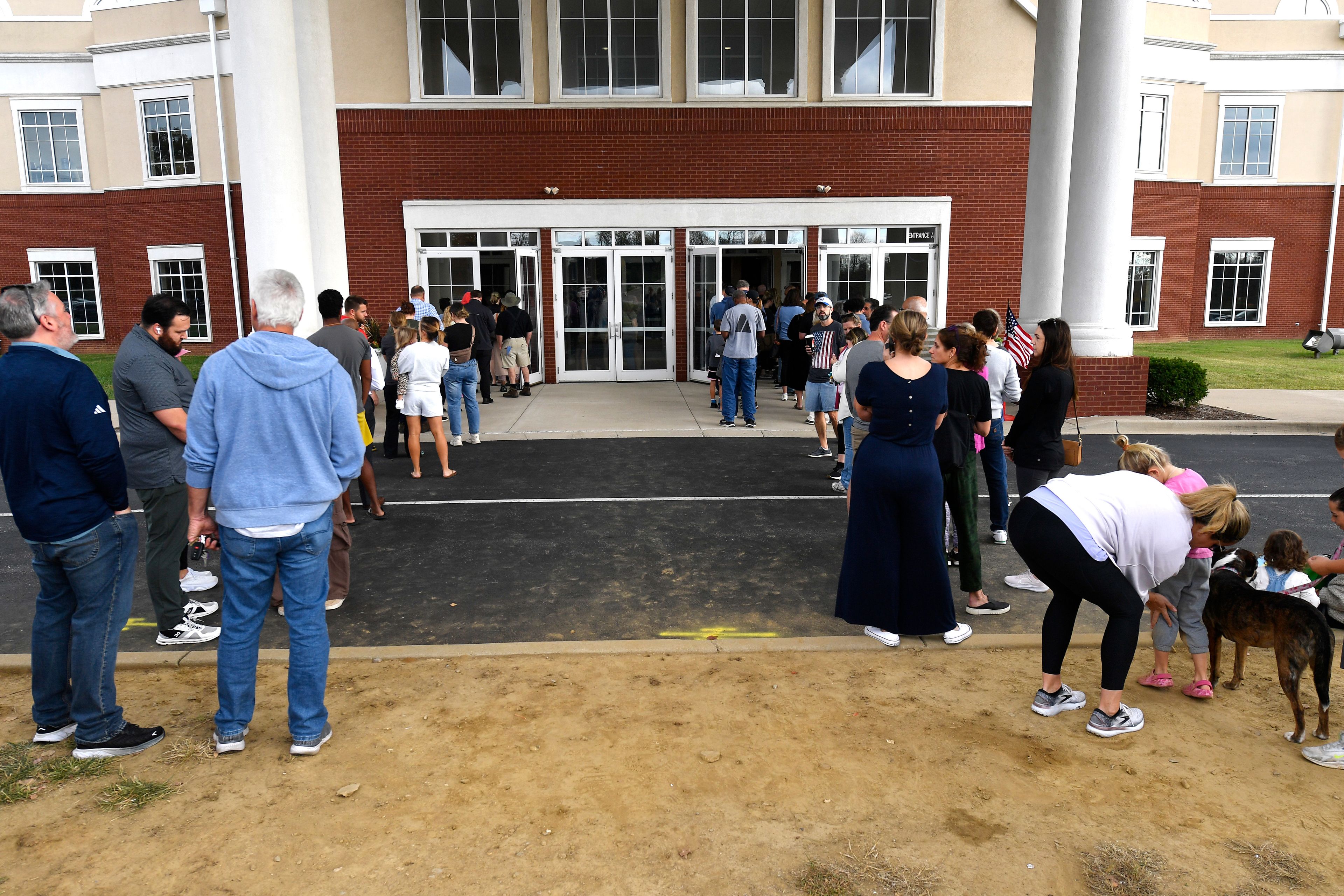 Voters line up to cast their ballots at the Highview Baptist Church East Campus in Louisville, Ky., Tuesday, Nov. 5, 2024. (AP Photo/Timothy D. Easley)