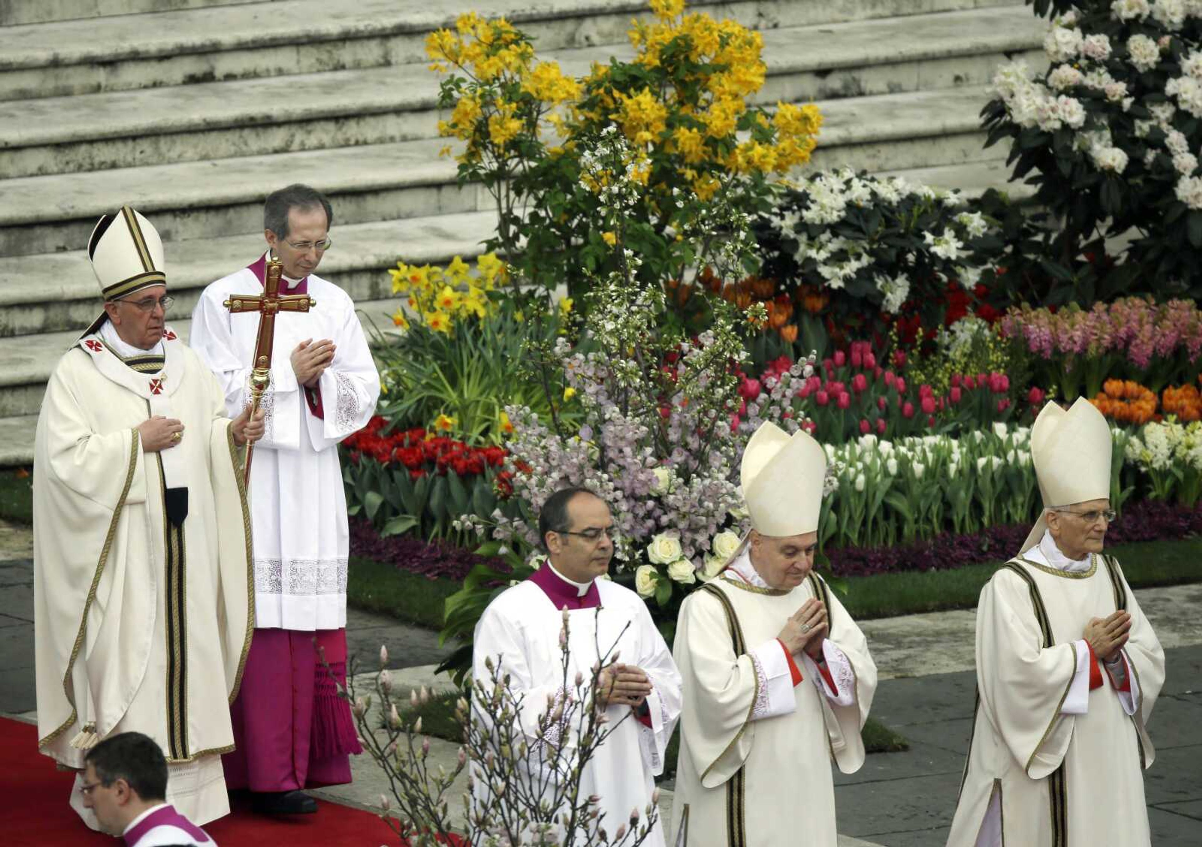 Pope Francis, holding the pastoral staff, celebrates Easter Mass in St. Peter&#8217;s Square on Sunday at the Vatican. (Gregorio Borgia ~ Associated Press)