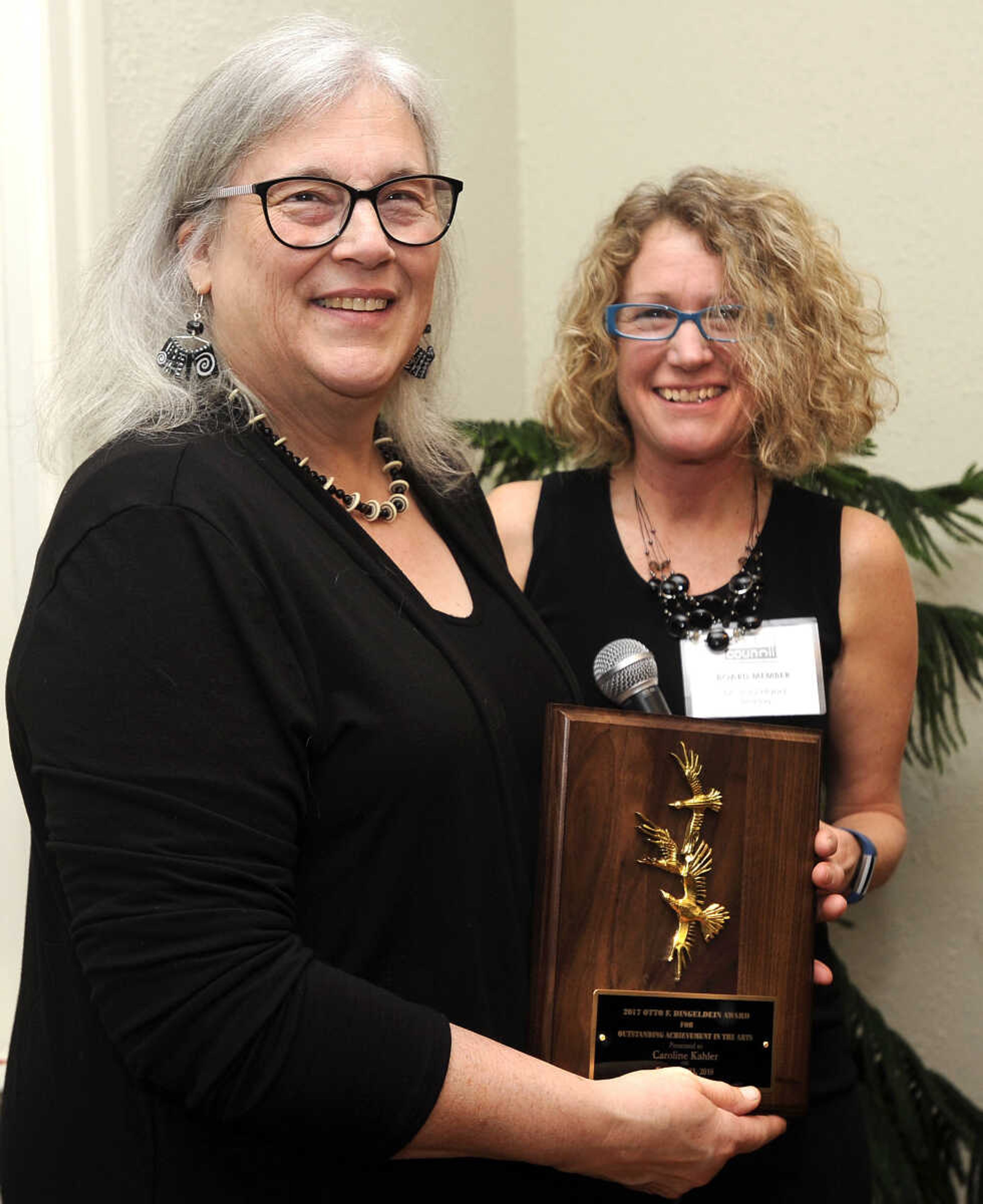 FRED LYNCH ~ flynch@semissourian.com
Caroline Kahler, left, receives the Otto F. Dingeldein Award from Joni Hand, board member of the Arts Council of Southeast Missouri, Friday, Feb. 23, 2018 in Cape Girardeau.