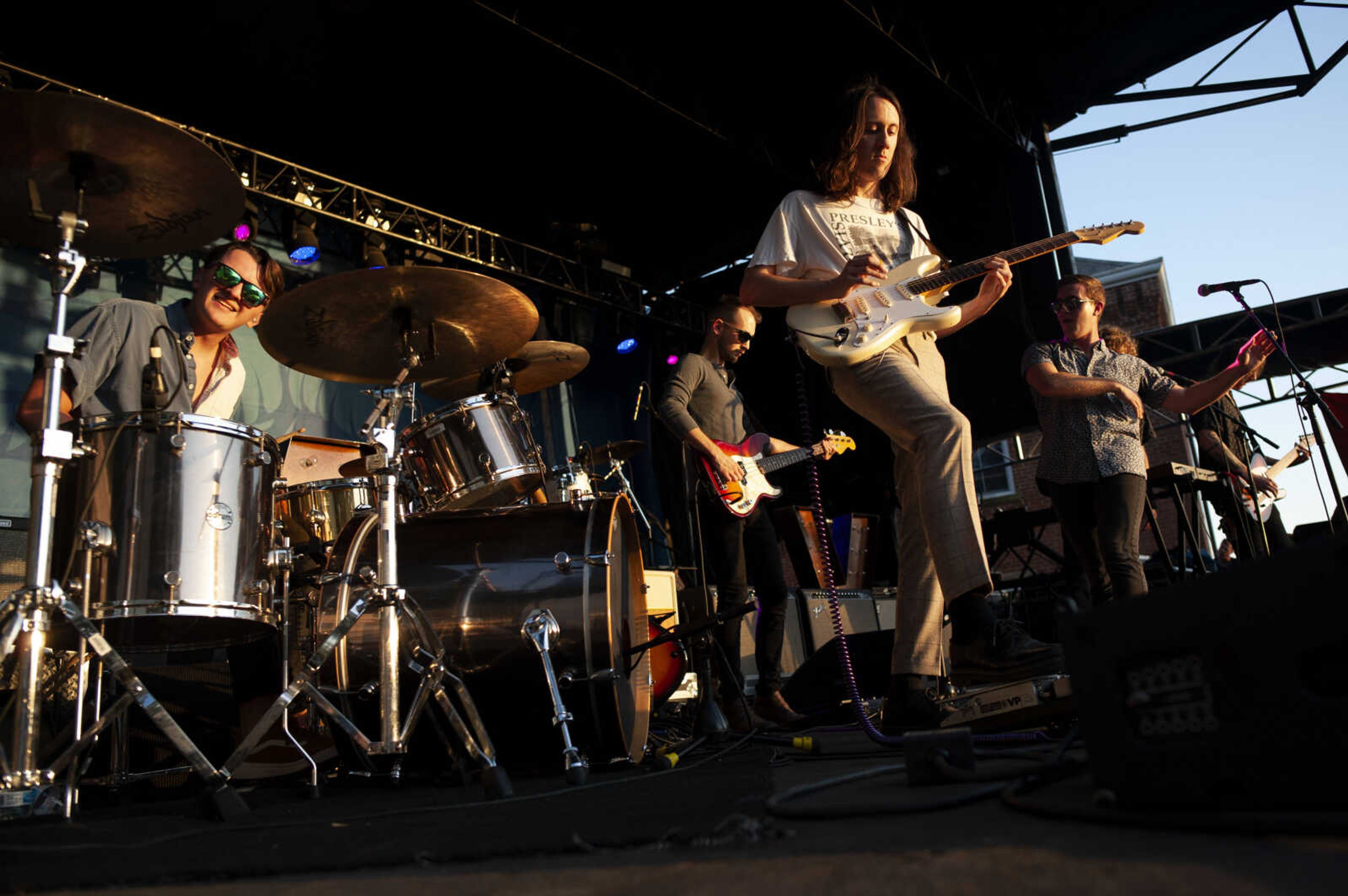 Taylor Bridges (in foreground), with the band Retro City, plays guitar while the band performs during Shipyard Music and Culture Festival on Friday, Sept. 27, 2019, in Cape Girardeau.