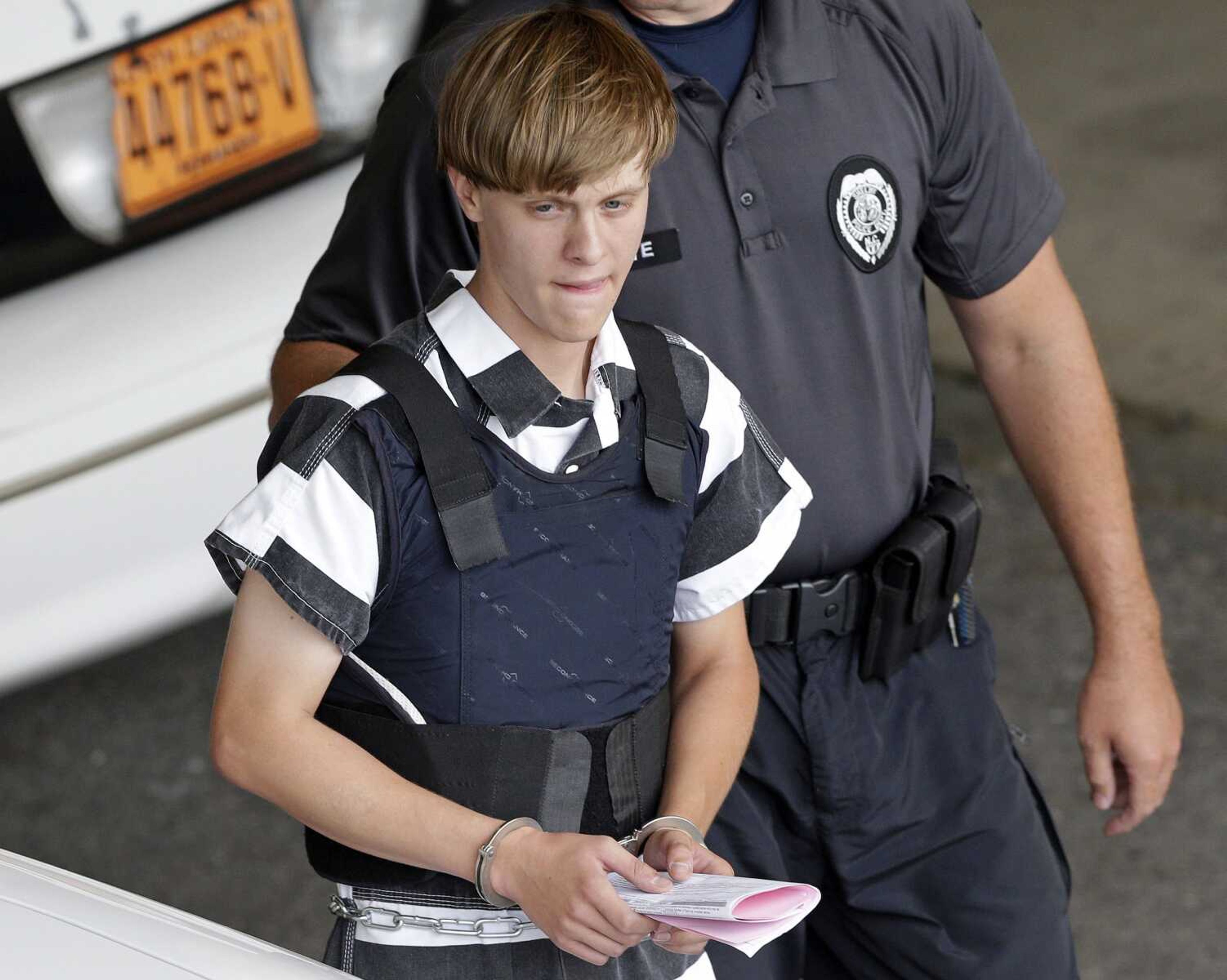 Charleston, South Carolina, shooting suspect Dylann Roof is escorted from the Cleveland County Courthouse on June 18, 2015, in Shelby, North Carolina. A federal jury Tuesday sentenced Roof to death for killing nine black church members in a racially motivated attack in 2015.