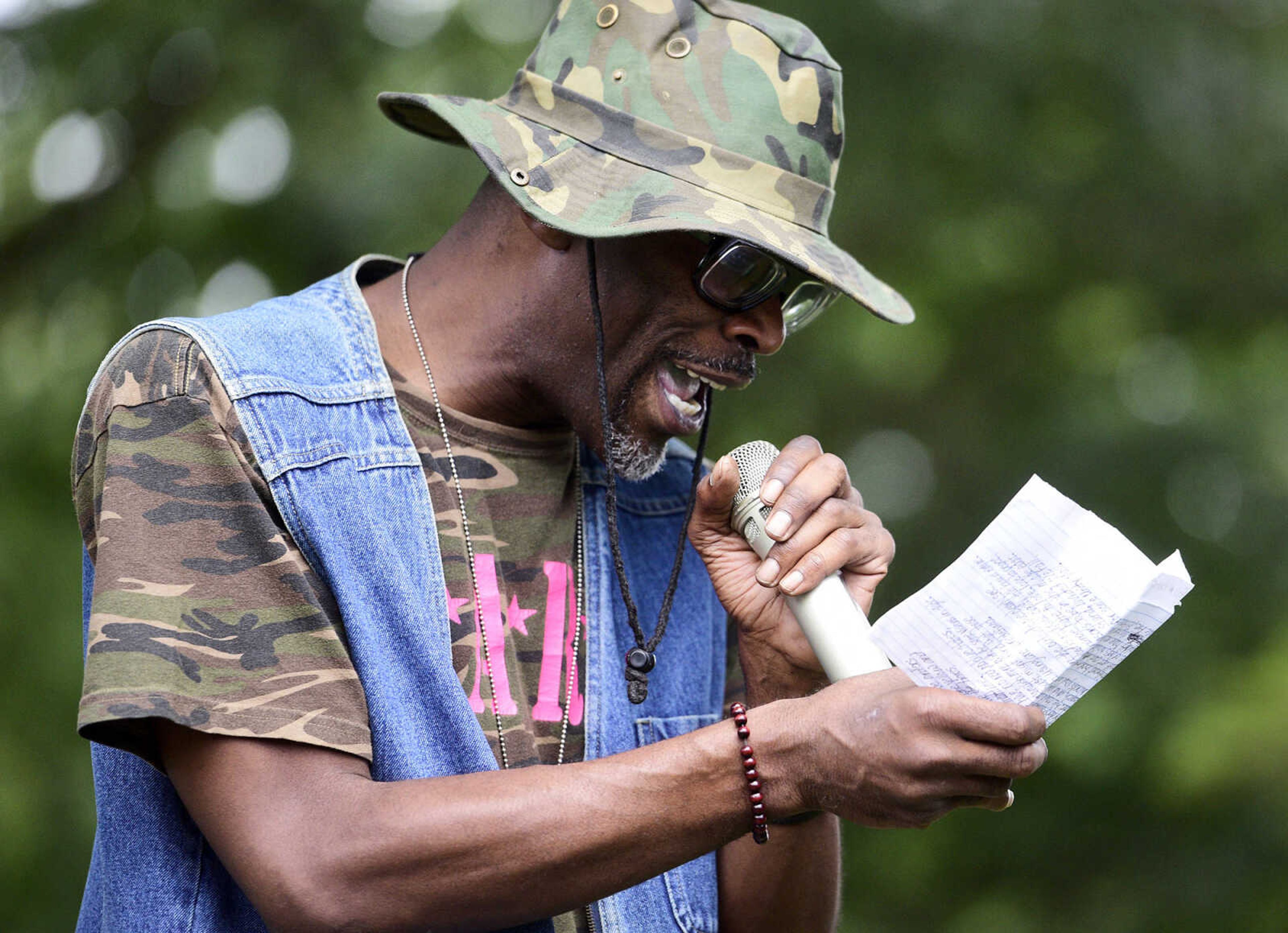 Michael "The Navigator" Council reads his poem "Executive Orders" during the Love, Not Hate rally on Sunday evening, Aug. 13, 2017, at Ivers Square in Cape Girardeau.