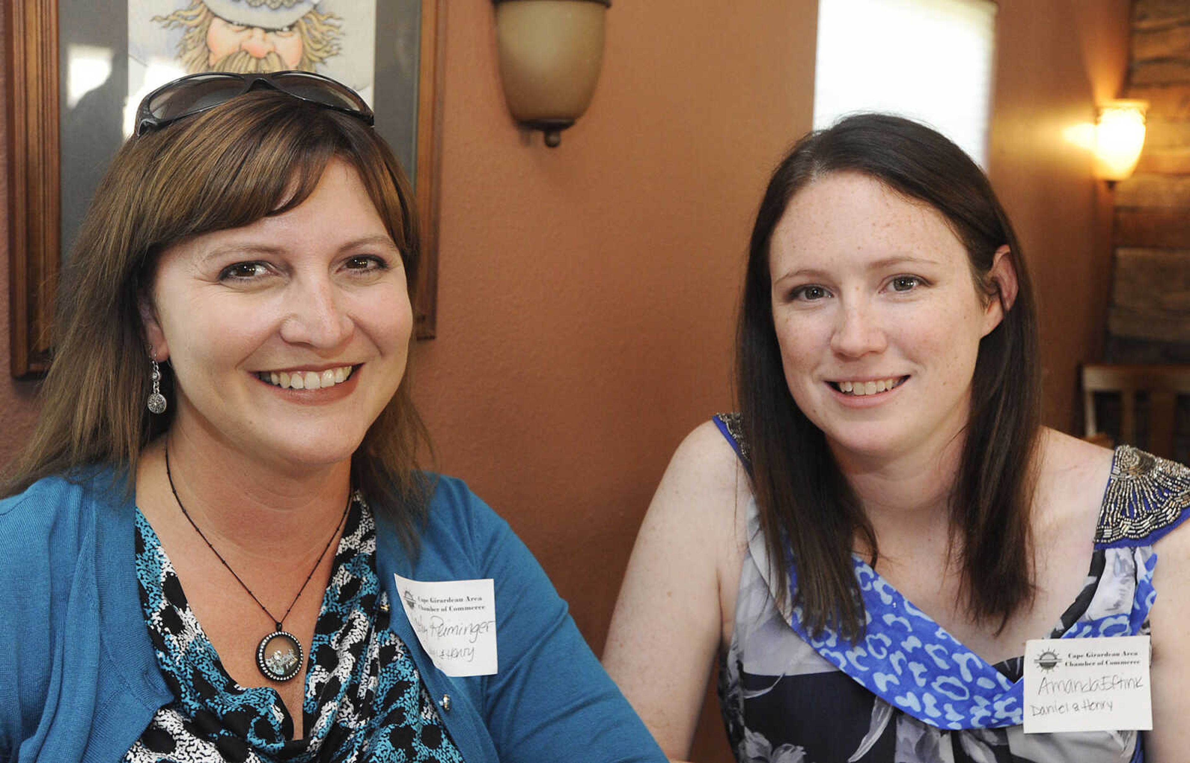 Cathy Reiminger, left, and Amanda Eftink of Daniel and Henry Co., at the Cape Girardeau Area Chamber of Commerce Business After Hours Tuesday, July 16, at the Hunter Valley Winery, 762 State Highway V, in Cape Girardeau.