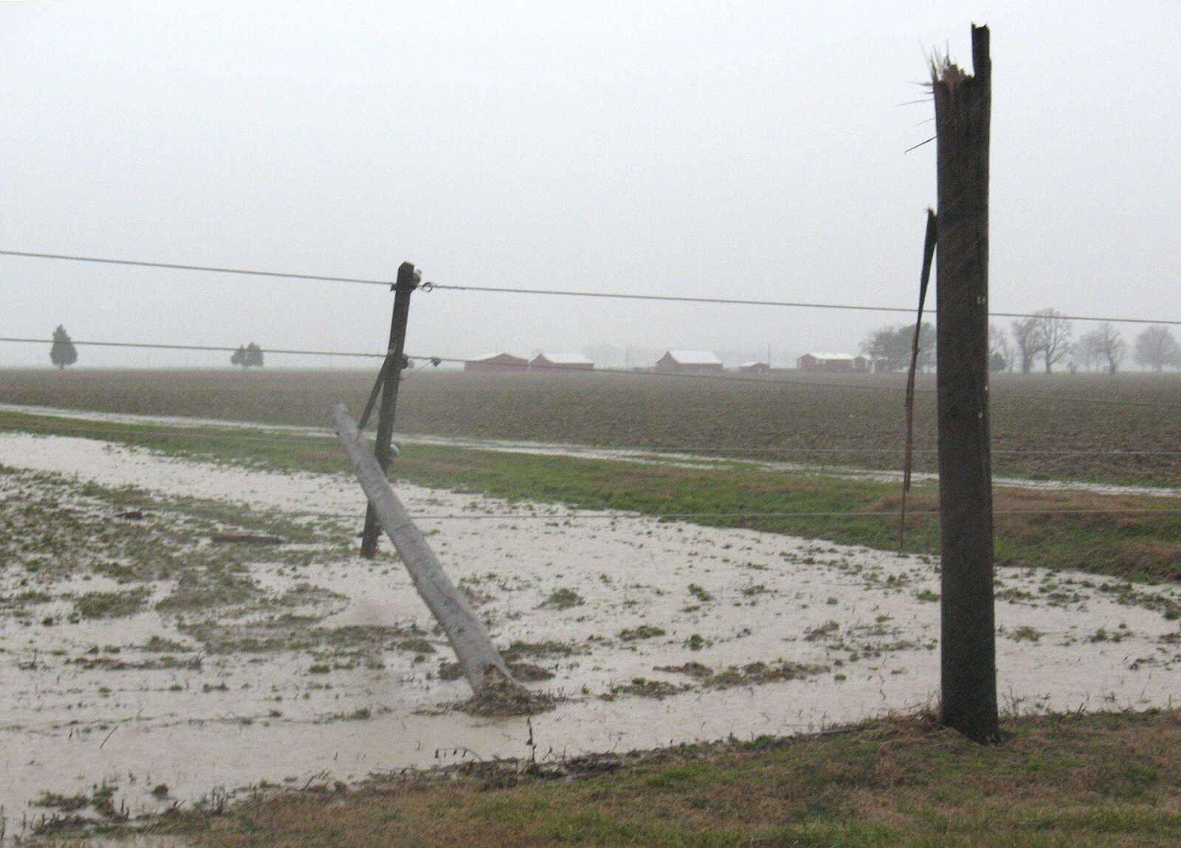 Debris from the storm was scattered in a nearby field. The strength of the storm also snapped several utility poles. (Bobby Greer ~ Dexter Daily Statesman)