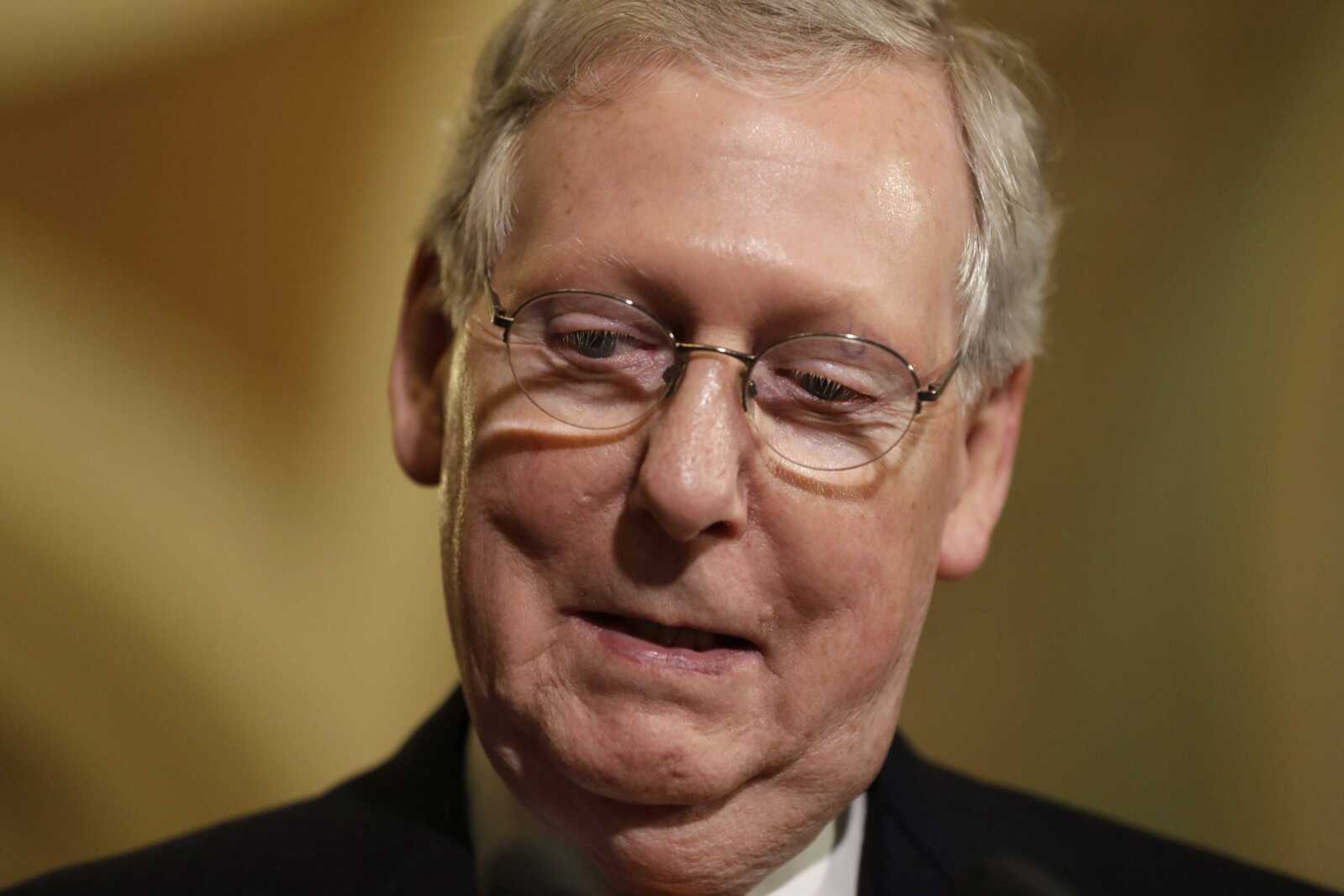 Senate Majority Leader Mitch McConnell of Kentucky pauses while meeting with reporters May 9 to discuss health care on Capitol Hill in Washington.