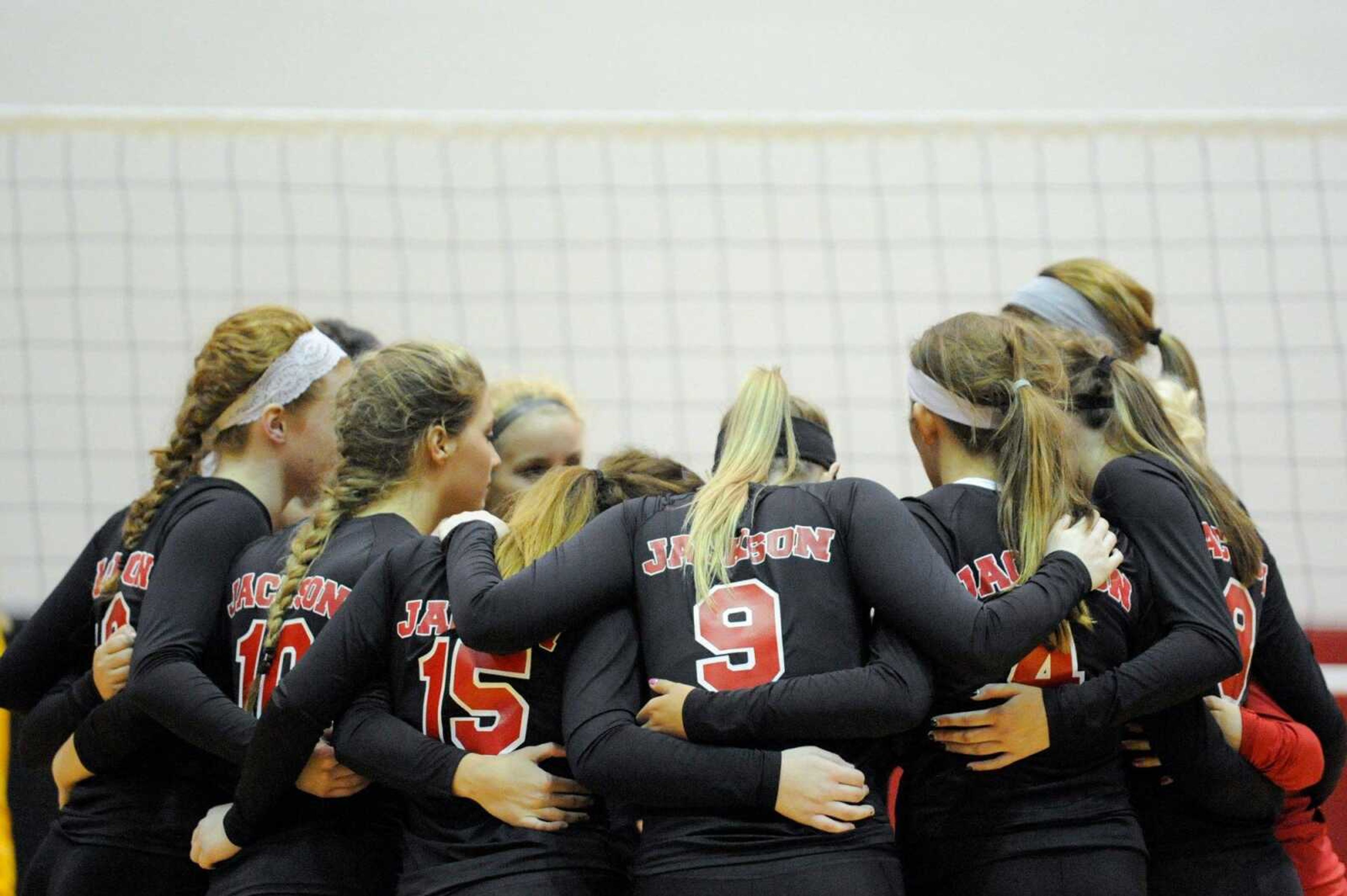 Jackson players huddle together before the start of their match against St. Vincent Tuesday, Aug. 25, 2015 in Jackson. (Glenn Landberg)