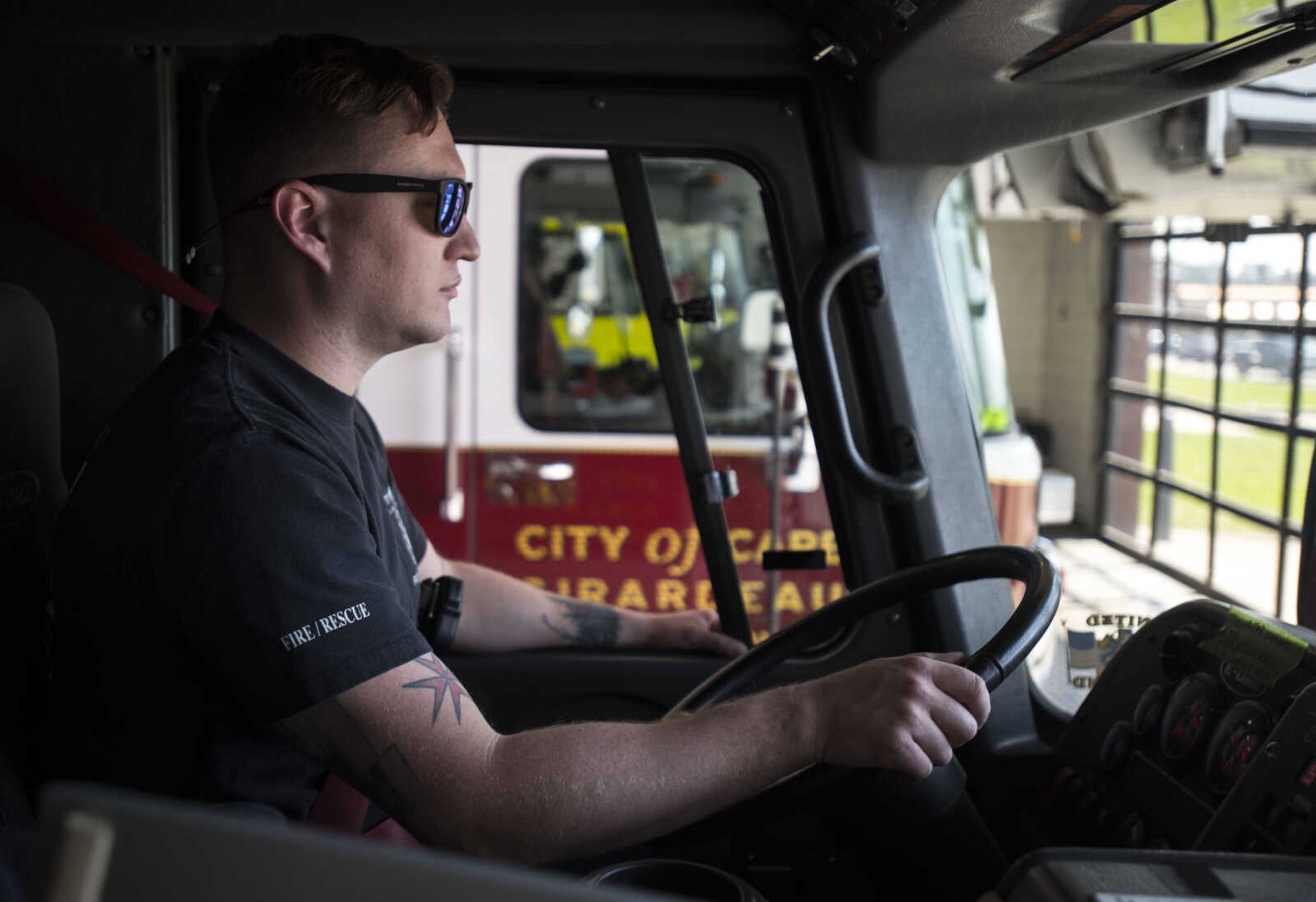 Cape Girardeau firefighter David Uptmor drives a firetruck out of Cape Girardeau Fire Station No. 1 on Tuesday, April 17, 2018, in Cape Girardeau.