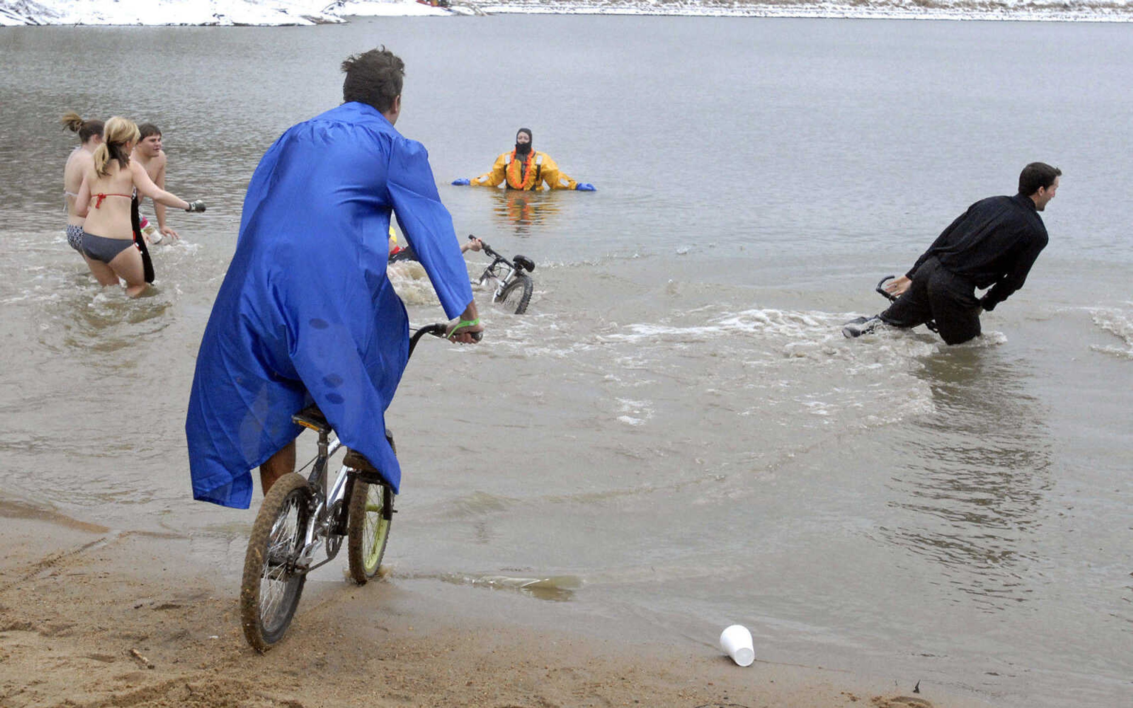 LAURA SIMON~lsimon@semissourian.com
The Holy Rollers plunge team ride their bicycles into Lake Boutin in Trail of Tears State Park Saturday, February 6, 2010 during the Polar Bear Plunge benefiting the Special Olympics. The Special Olympics hopes to raise 36,000 during this years Polar Bear Plunge. Over 210 people plunged into Lake Boutin Saturday.