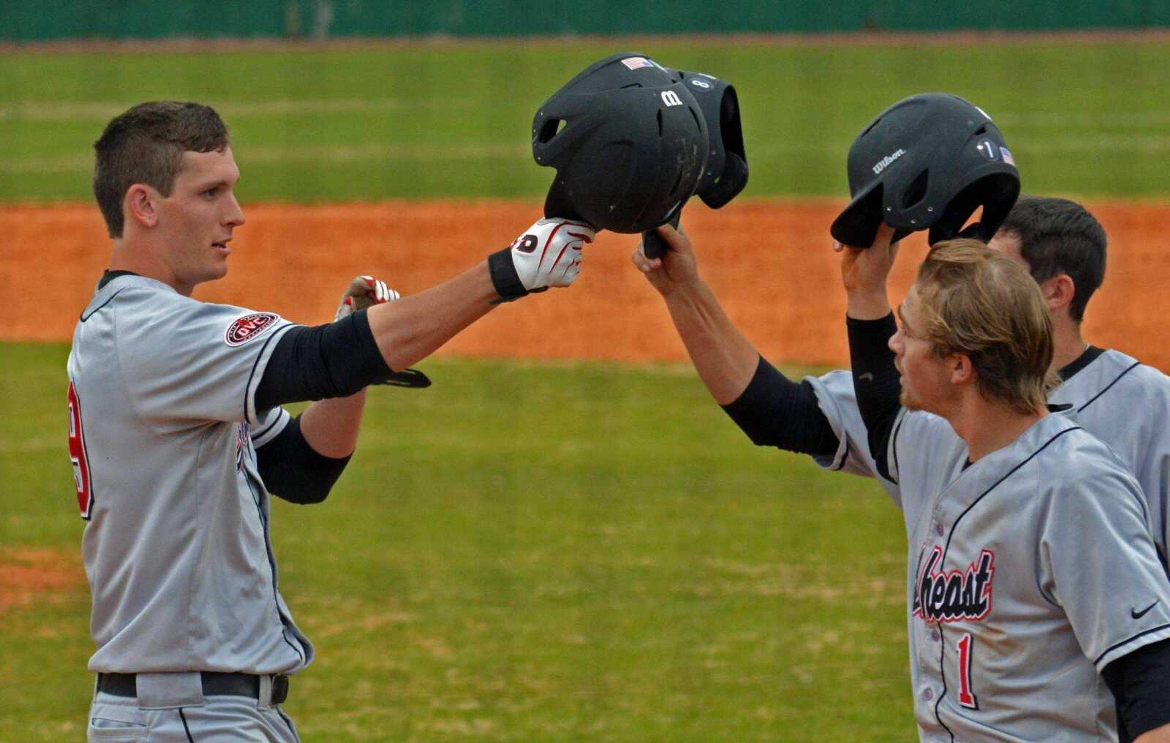 Southeast Missouri State&#8217;s Matt Tellor is congratulated at home plate by teammates Andy Lack (1) and Jason Blum after hitting a three-run home run against Tennessee Martin during the seventh inning Friday in Martin, Tenn. Southeast won 13-0. (WAYNE MCPHERSON ~ Special to Southeast Missourian)