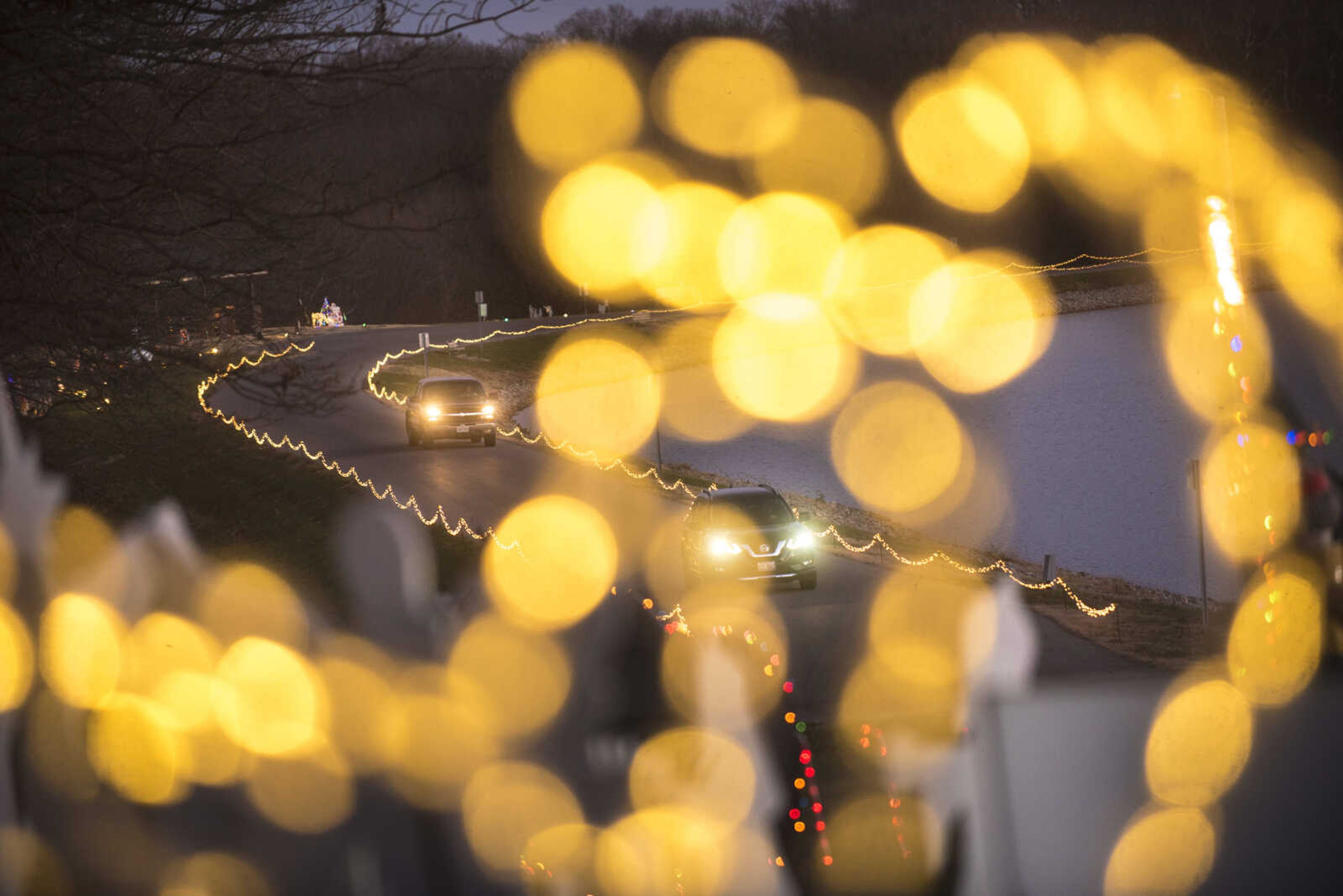 Cars drive through the Holiday of Lights Display Wednesday, Dec. 13, 2017 at Cape Girardeau County Park.