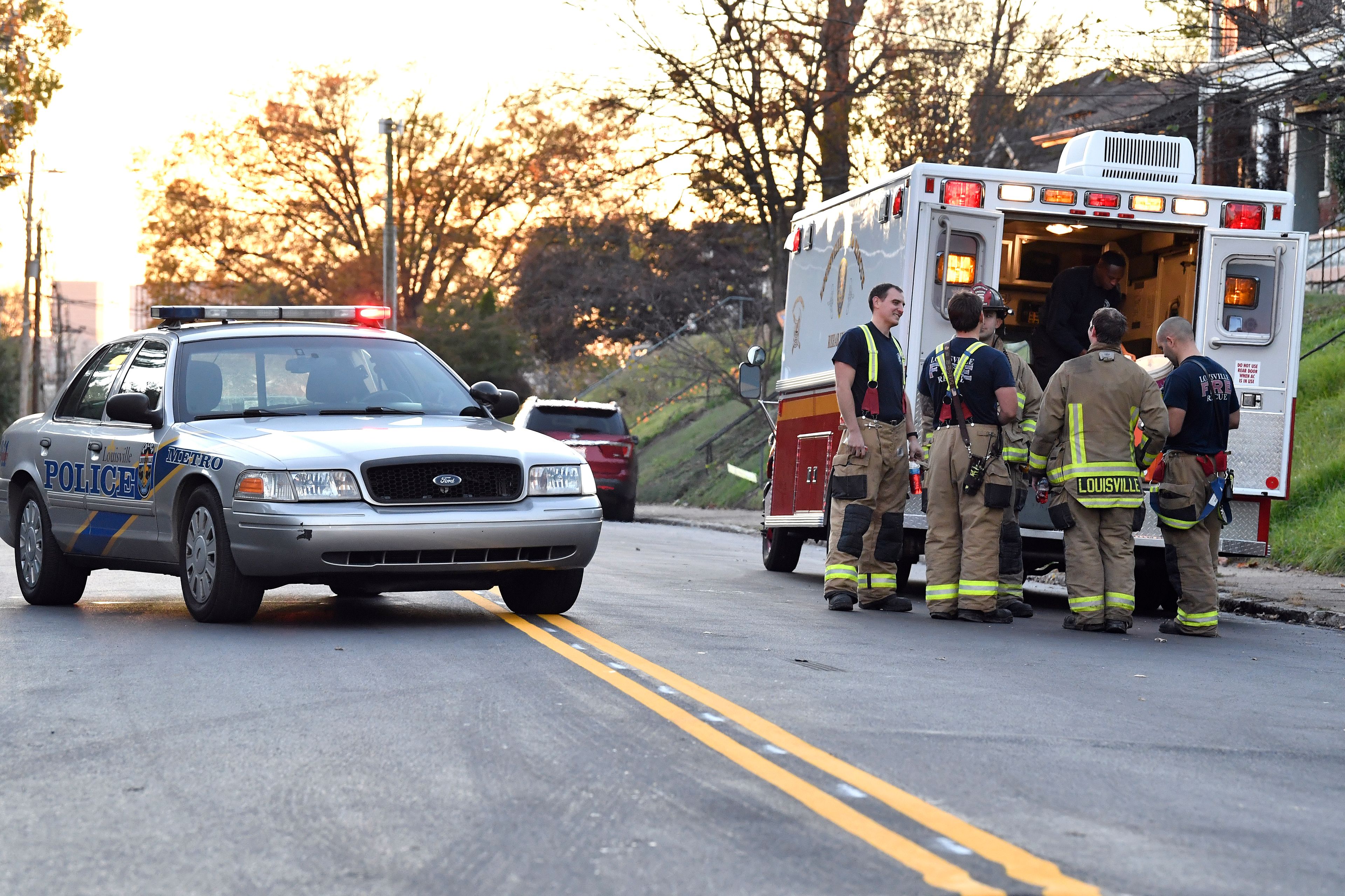 Members of the Louisville Fire Departments check their gear as they prepare to enter Givaudan Sense Colour following an explosion at the facility in Louisville, Ky., Tuesday, Nov. 12, 2024. (AP Photo/Timothy D. Easley)