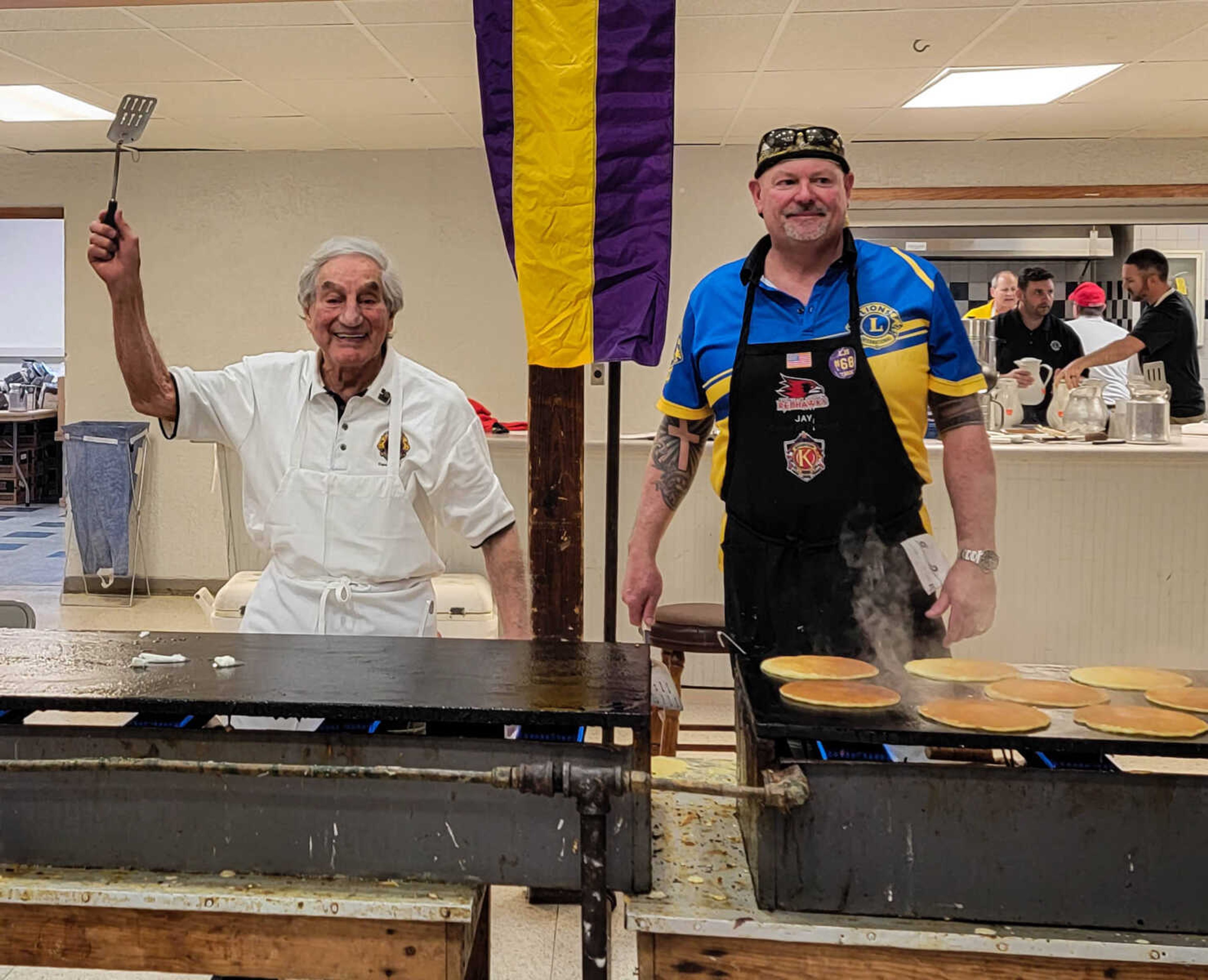 Eddie Noffel and Jay Knudtson pose for a photo during the 84th annual Lions Club Pancake Day.