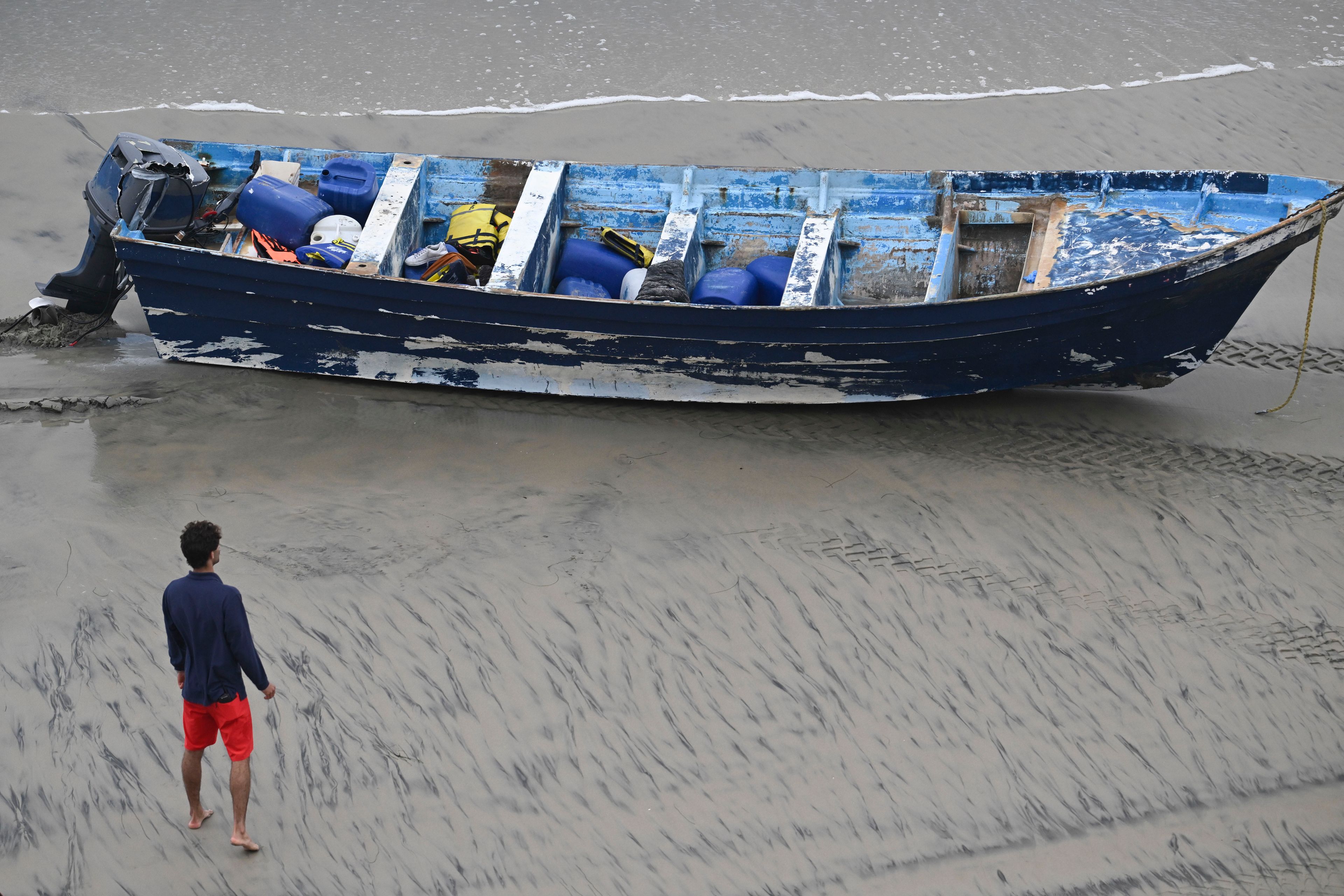 5 people charged after migrant boat capsized, killing 3, including 14-year-old boy from India