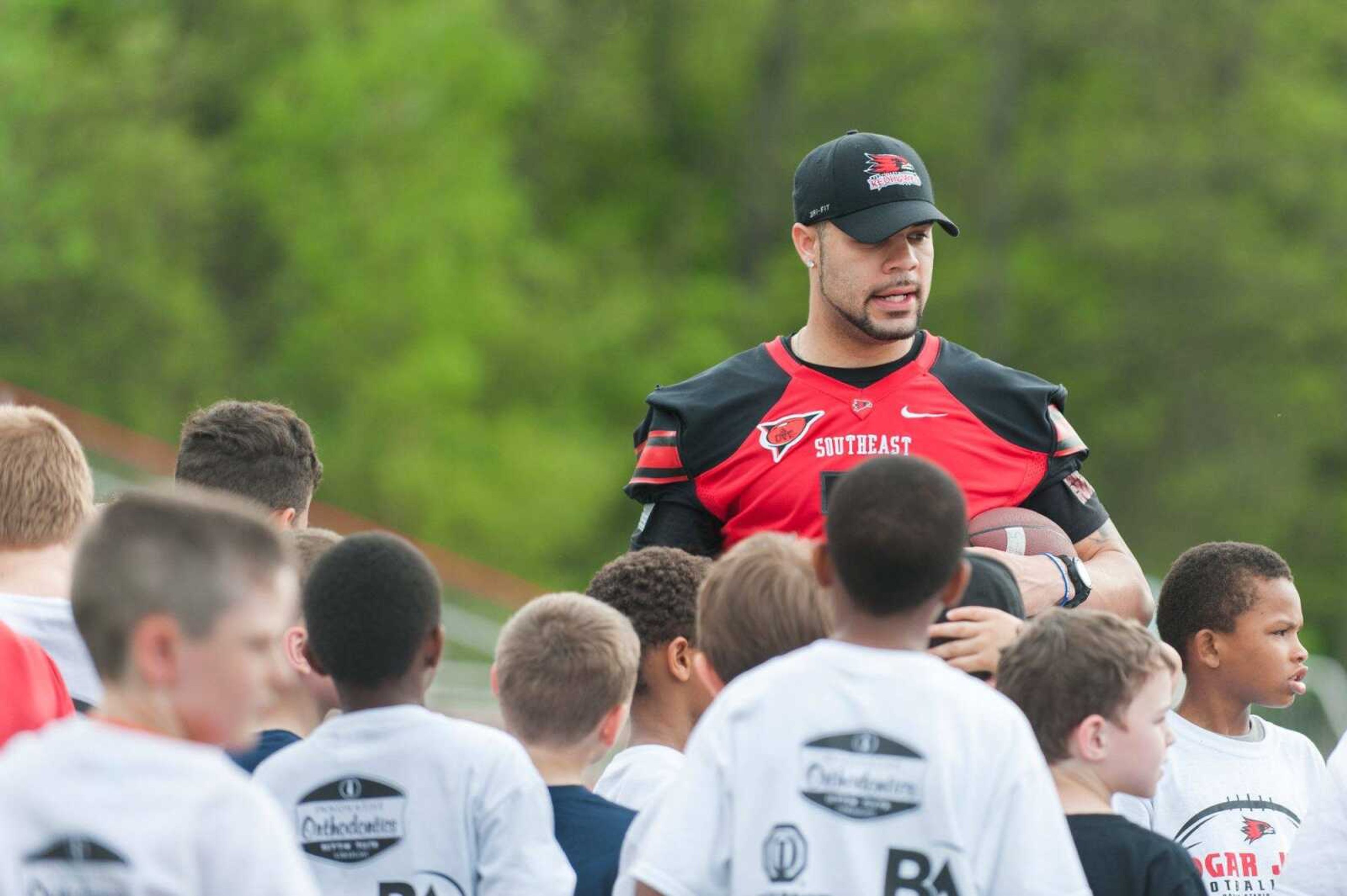 Southeast Missouri State's Tay Bender explains a drill at the second annual Edgar Jones youth football clinic Saturday, April 18, 2015 at Houck Stadium. (Glenn Landberg)