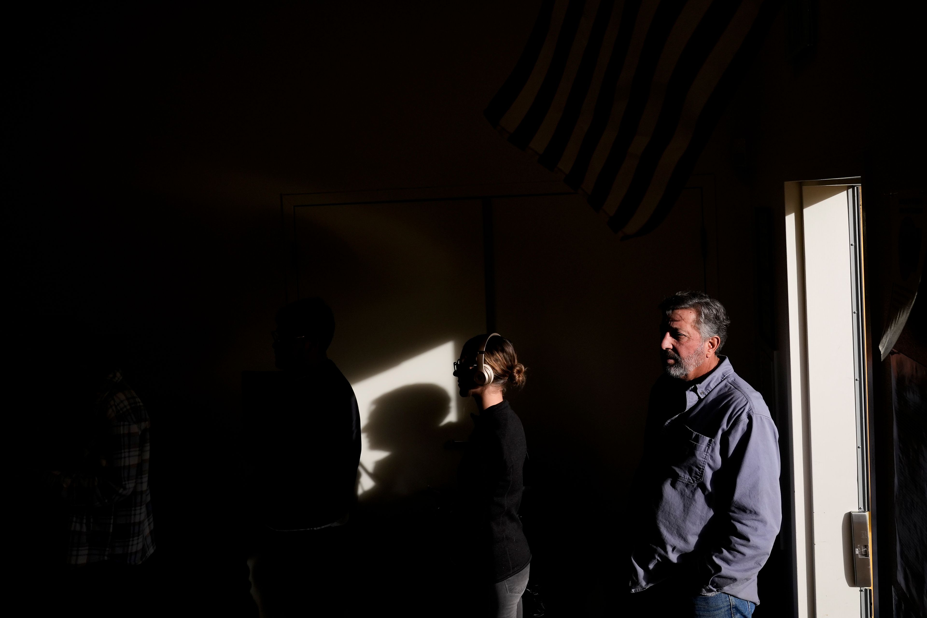 People wait in line to vote at South Valleys Library, Tuesday, Nov. 5, 2024, in Reno, Nev. (AP Photo/Godofredo A. Vasquez)