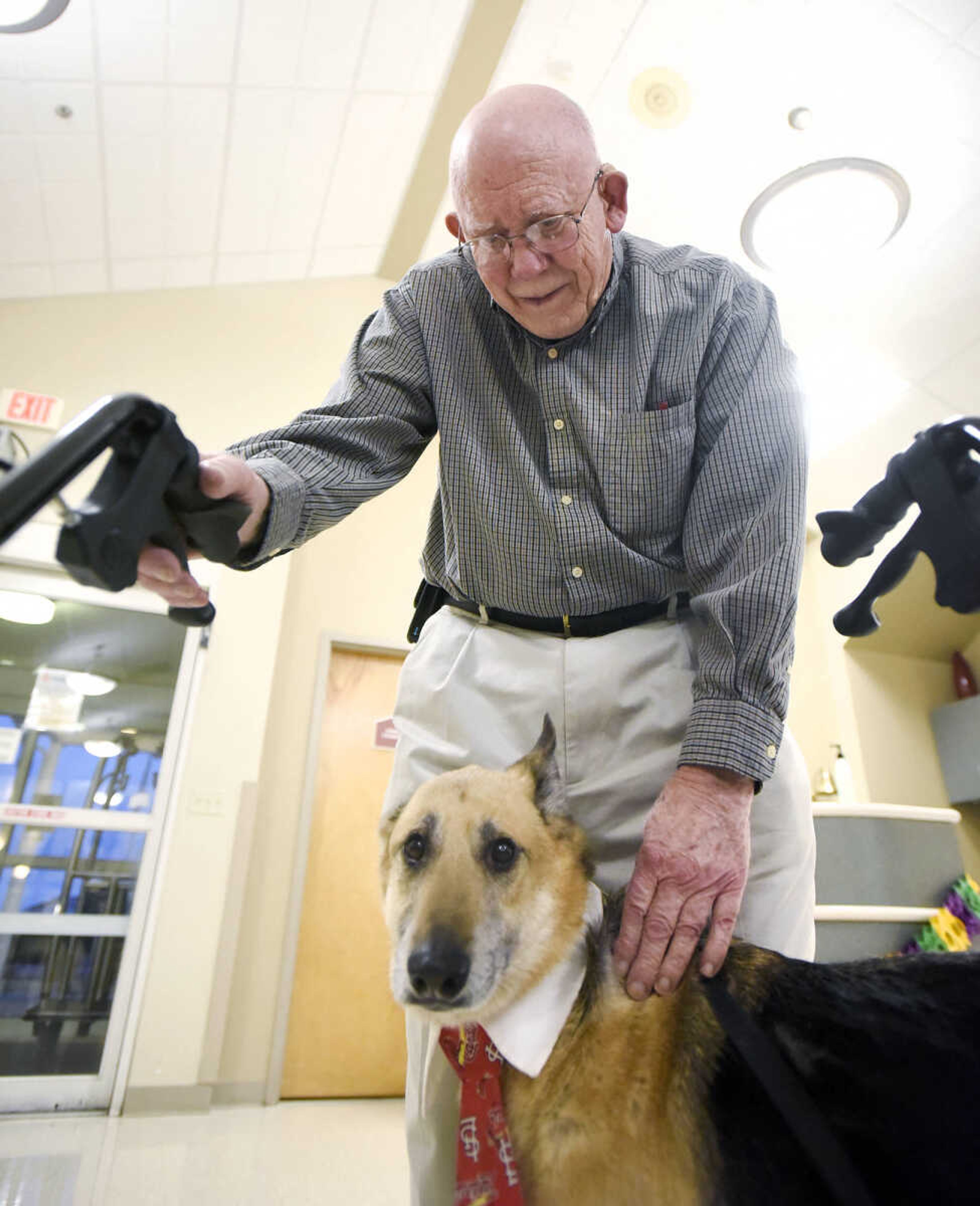 Ron Shannon visits with Max on Tuesday, Feb. 21, 2017, during the Pet Pals stop at the Missouri Veteran's Home in Cape Girardeau.