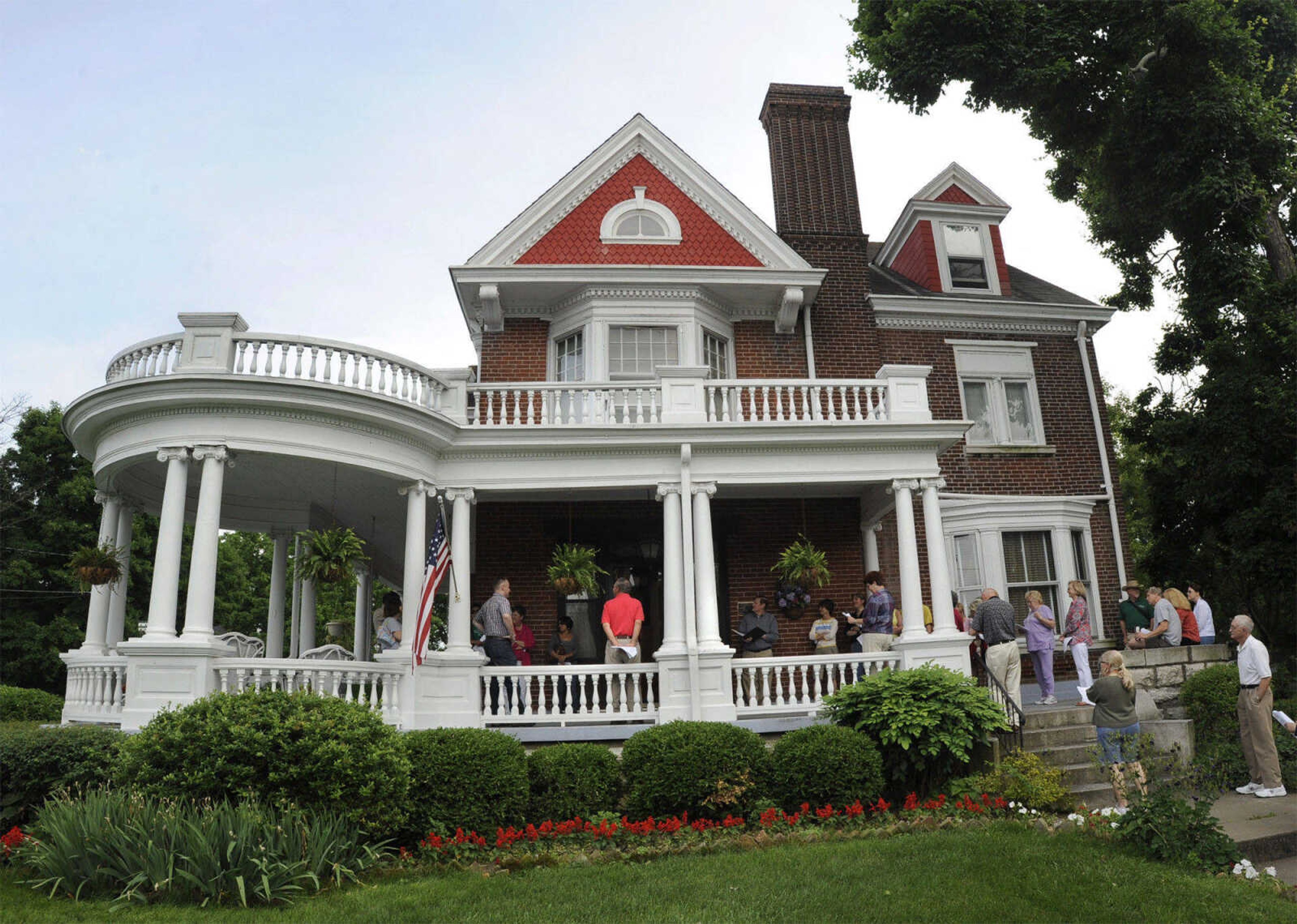 The Harrison House, 313 Themis, is so-called because three generations of that family lived in the house from 1903 until 1986. It's a two-and-a-half story, brick, free classic Queen Anne home. Built in 1897-98, the home was designed by prominent St. Louis architect Jerome B. Legg.