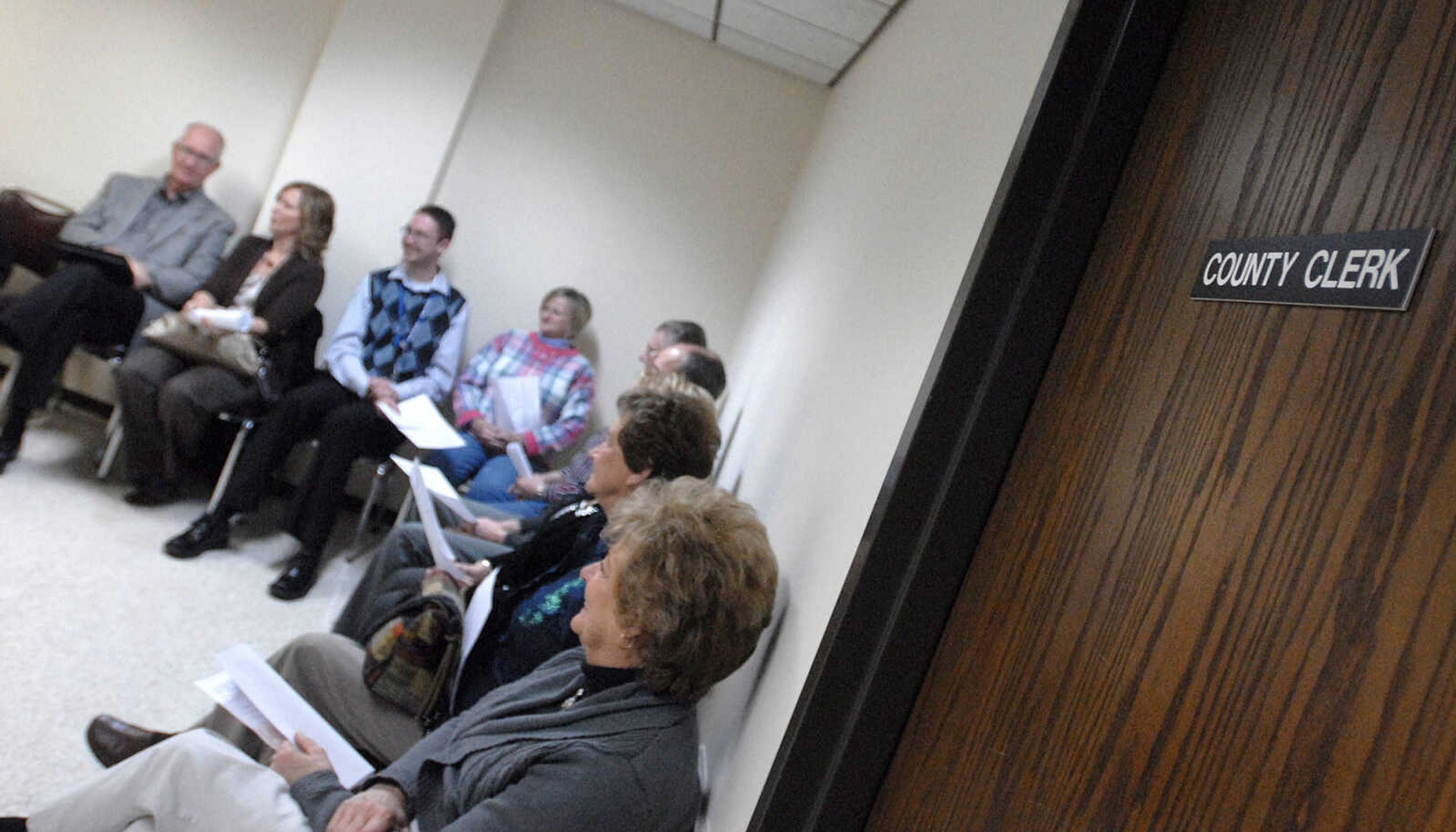 LAURA SIMON ~ lsimon@semissourian.com
Candidates wait for Cape Girardeau County Clerk Kara Clark Summers' office to open shortly before 8 a.m. Tuesday.