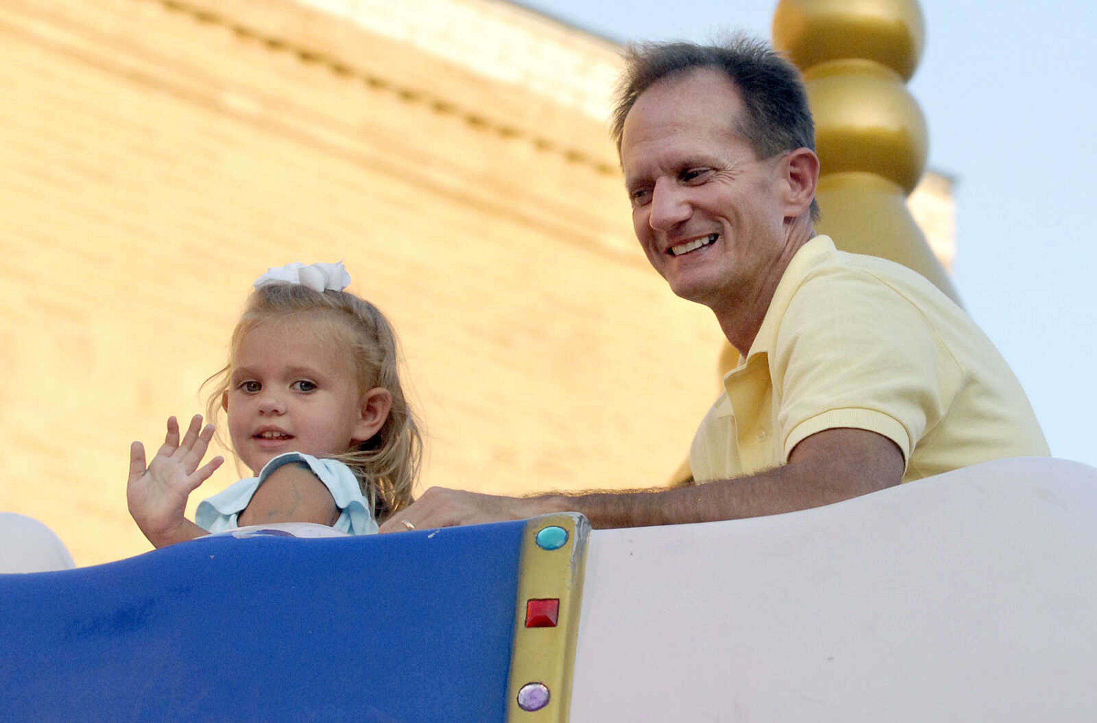 LAURA SIMON ~ lsimon@semissourian.com
Brad and Jacqualyn Johnson take a spin on the pink elephants Tuesday, July 26, 2011 during the 103rd annual Jackson Homecomers celebration.