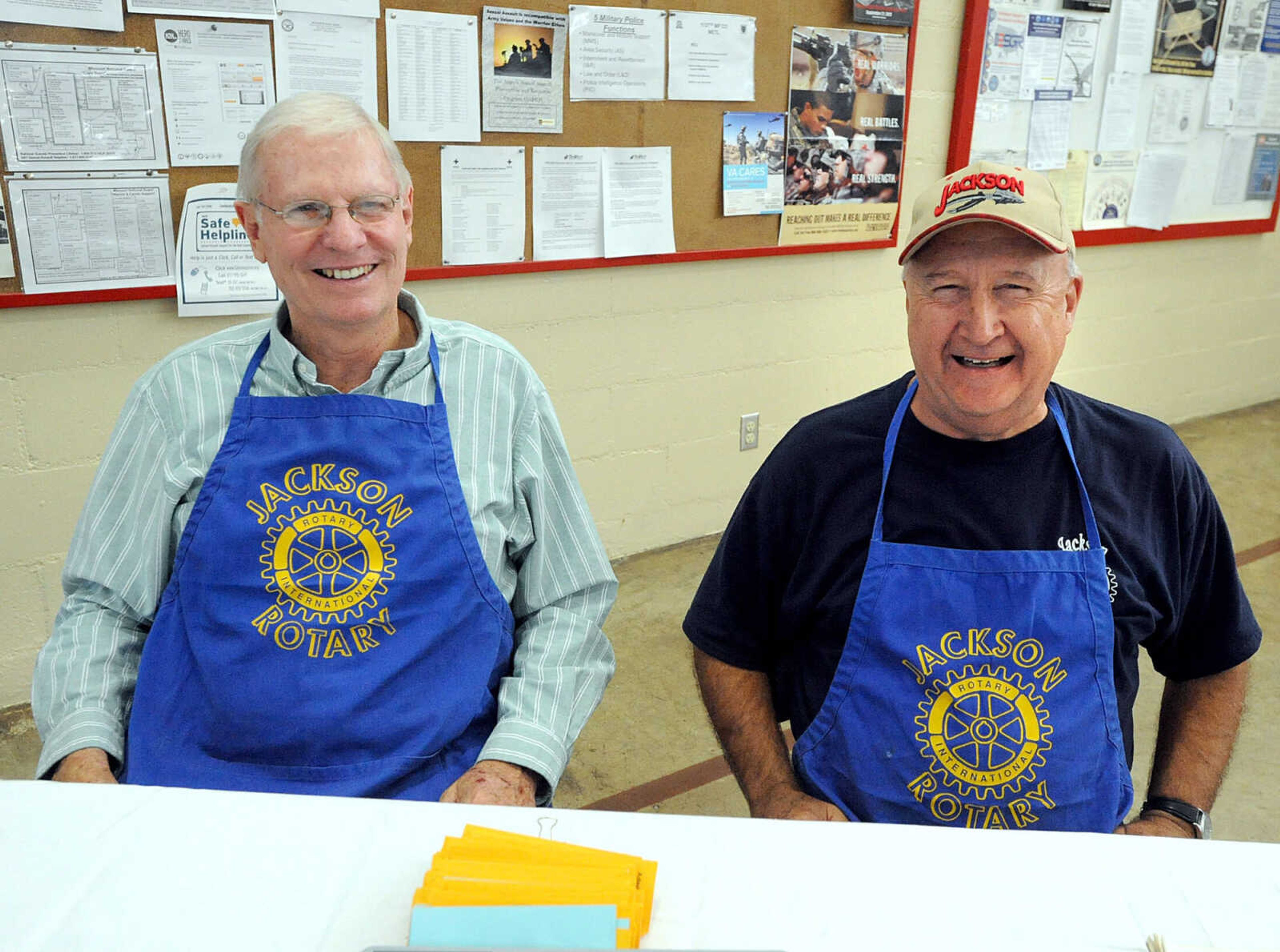 LAURA SIMON ~ lsimon@semissourian.com
Marvin Adams, left, and Brad Kasten greet customers at the entrance Tuesday, Oct. 23, 2012 during the Jackson Rotary Pancake Day at the National Guard Armory. People could pick from plain, chocolate chip, pecan and blueberry pancakes and a side of sausage.