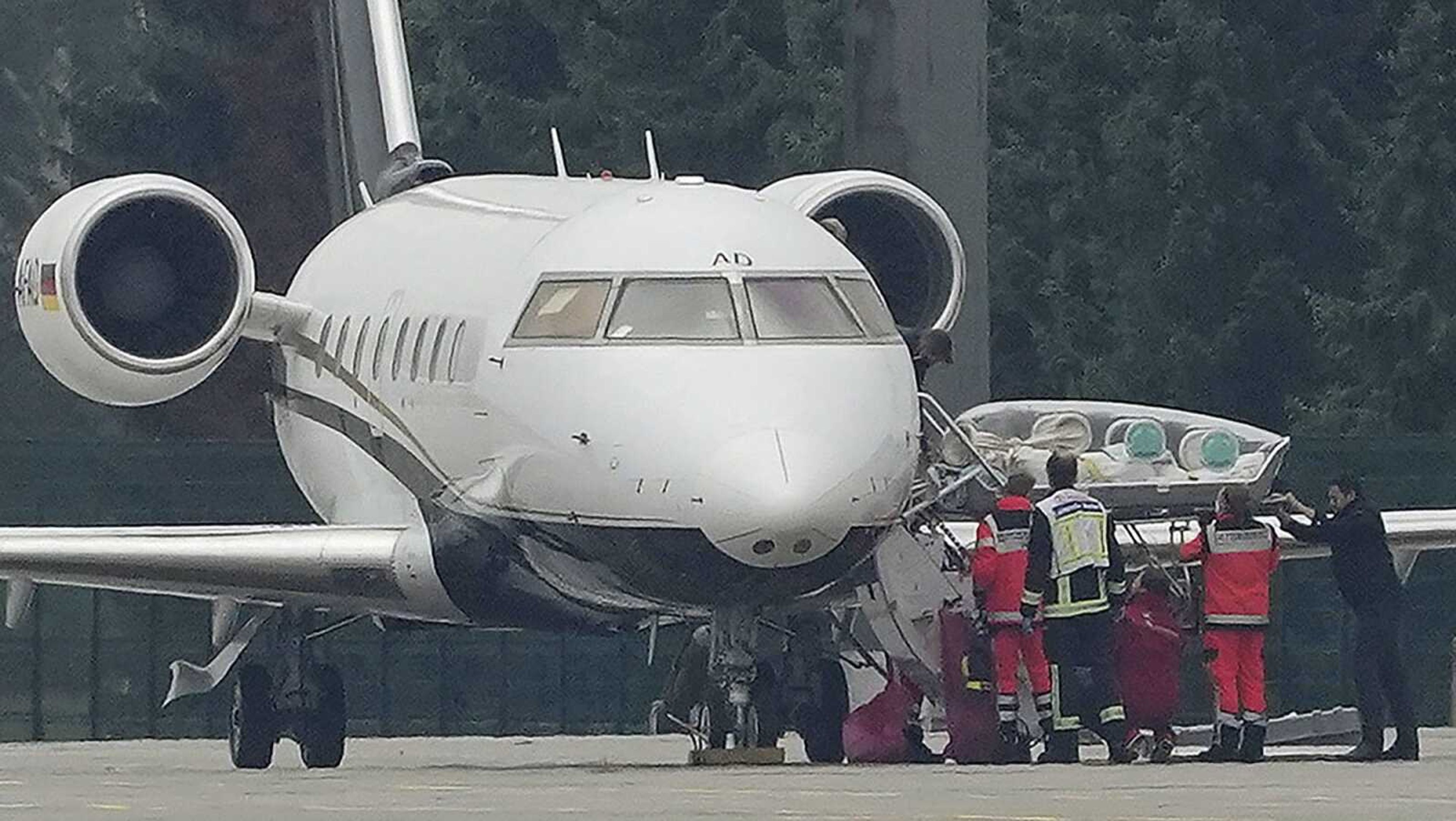 A stretcher is taken from special aircraft with the Kremlin critic Alexei Navalny on board Saturday at Tegel Airport in Berlin. The Russian opposition member has been in a coma since Thursday and is on artificial respiration has been flown to Germany to receive treatment.