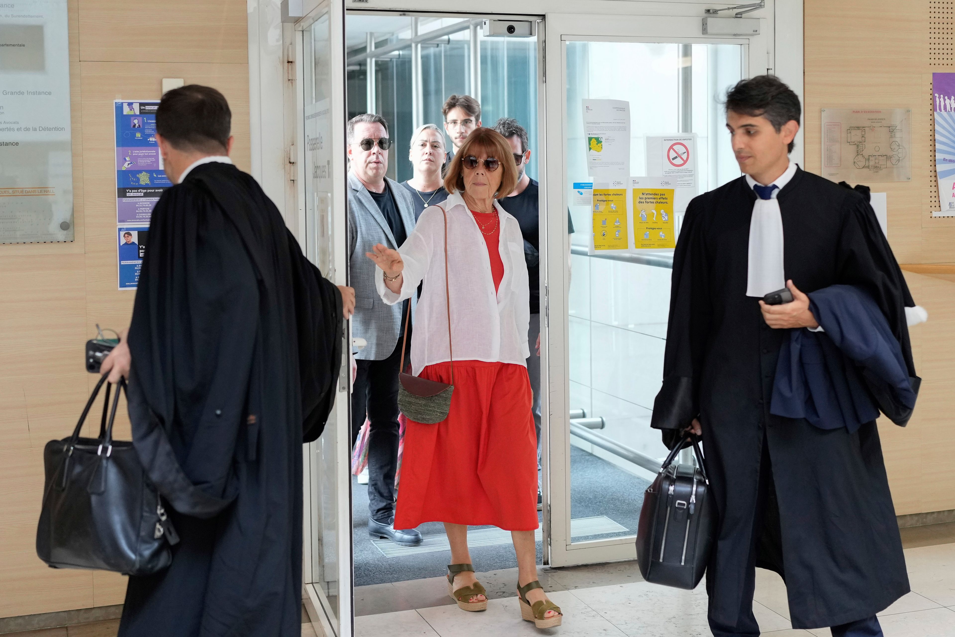 FILE - Gisele Pelicot, left, arrives in the Avignon court house, in Avignon, southern France, Thursday, Sept. 5, 2024. (AP Photo/Lewis Joly, File)