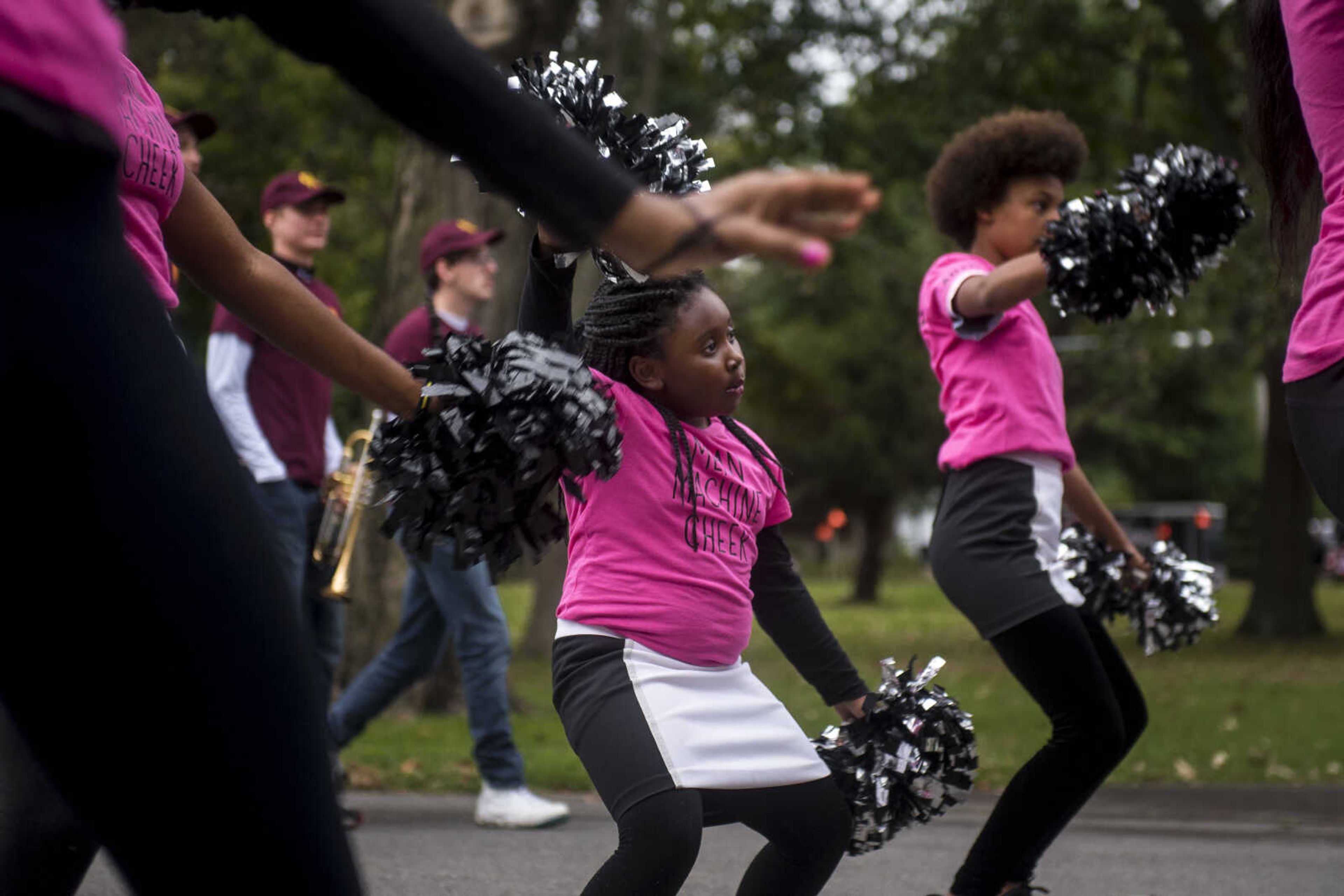 Paulajo Wigfall, 6, center, dances with her cheerleading squad during the Southeast Missouri State University homecoming parade Saturday, Oct. 13, 2018.