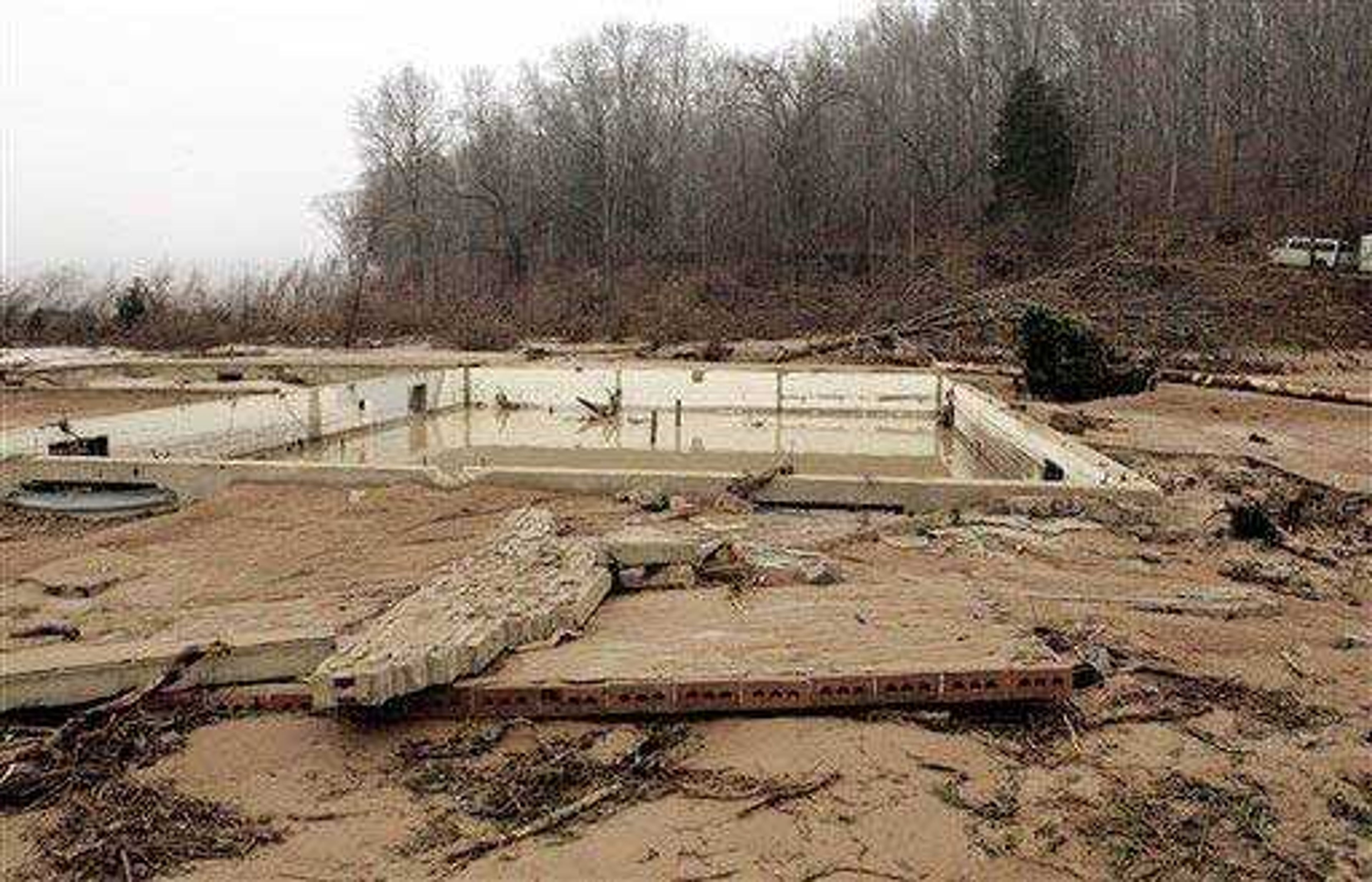 Floodwaters from the reservoir breach washed away the superintendent's house at Johnson Shut-Ins State Park, leaving only the foundation. The superintendent's family was rescued.  (Associated Press)