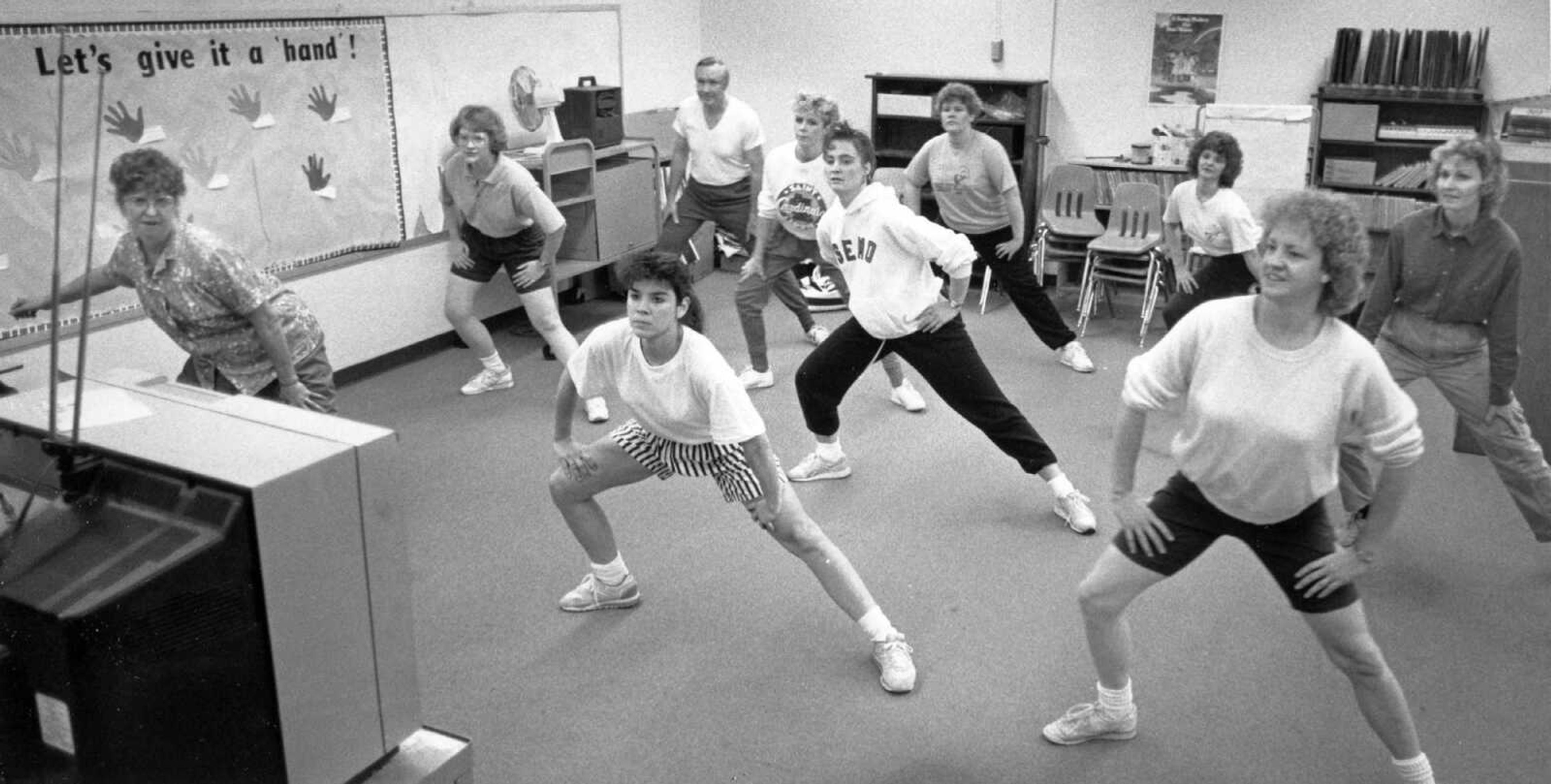 Published Jan. 18, 1990.
School was out, the students were gone, and the May Greene Elementary School staff gathered around a television for a video aerobics session. City schools were promoting staff wellness to set a good example for students. (Fred Lynch ~ Southeast Missourian archive)