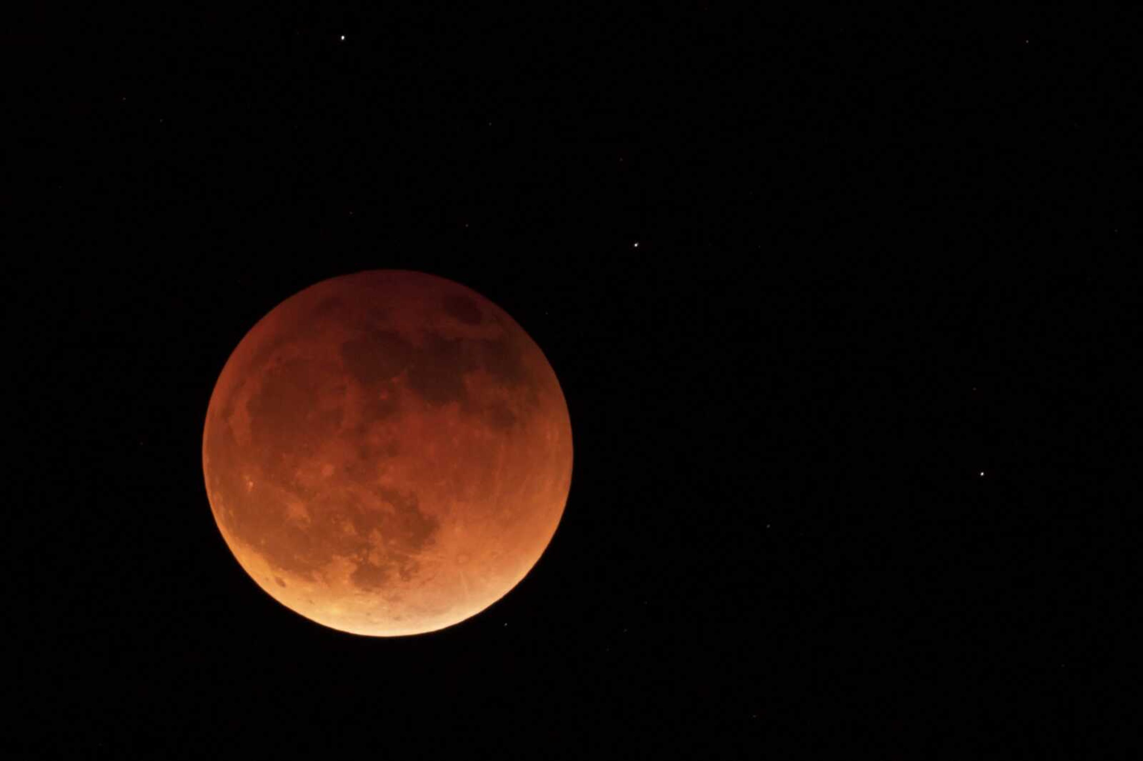 The moon is shown during a full lunar eclipse May 15 near Moscow, Idaho, with the reddish color caused by it passing into the shadow of the Earth. A Tuesday, Nov. 8, total lunar eclipse will be visible throughout North America in the predawn hours and across Asia, Australia and the rest of the Pacific after sunset.