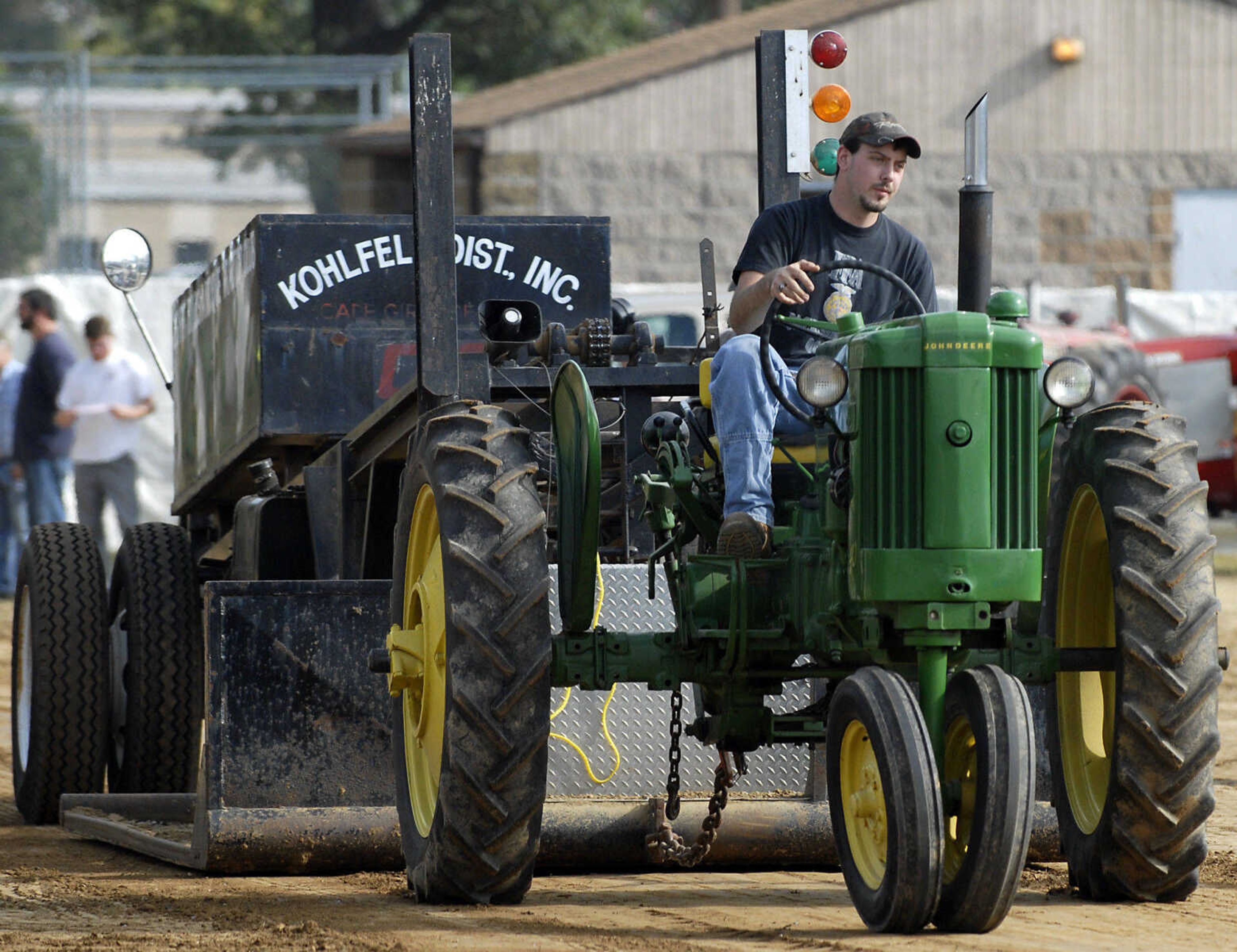 KRISTIN EBERTS ~ keberts@semissourian.com

Lance Stadt drives his 1953 John Deere 40 tractor during the antique tractor pull put on by the Egypt Mills Antique Tractor Club at the SEMO District Fair on Saturday, Sept. 10, 2011.