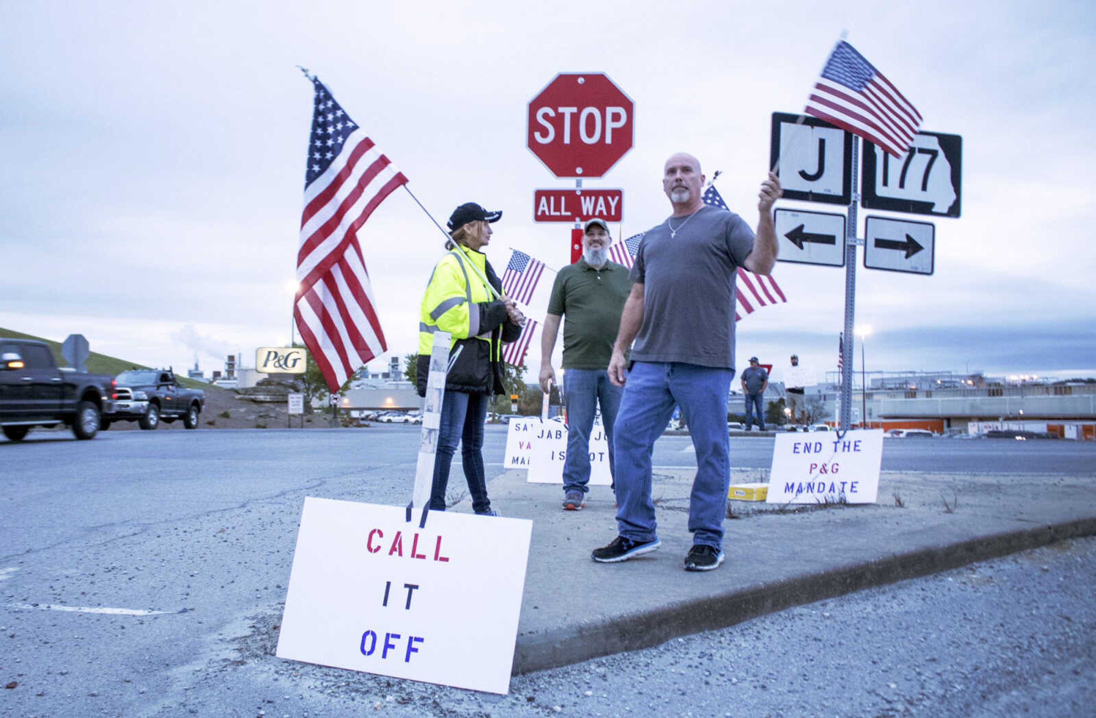 From left, Connie Combs, Steve Beal and James Moss protest Procter & Gamble's COVID-19 vaccine mandate Wednesday outside the manufacturer's facility in northeastern Cape Girardeau County.