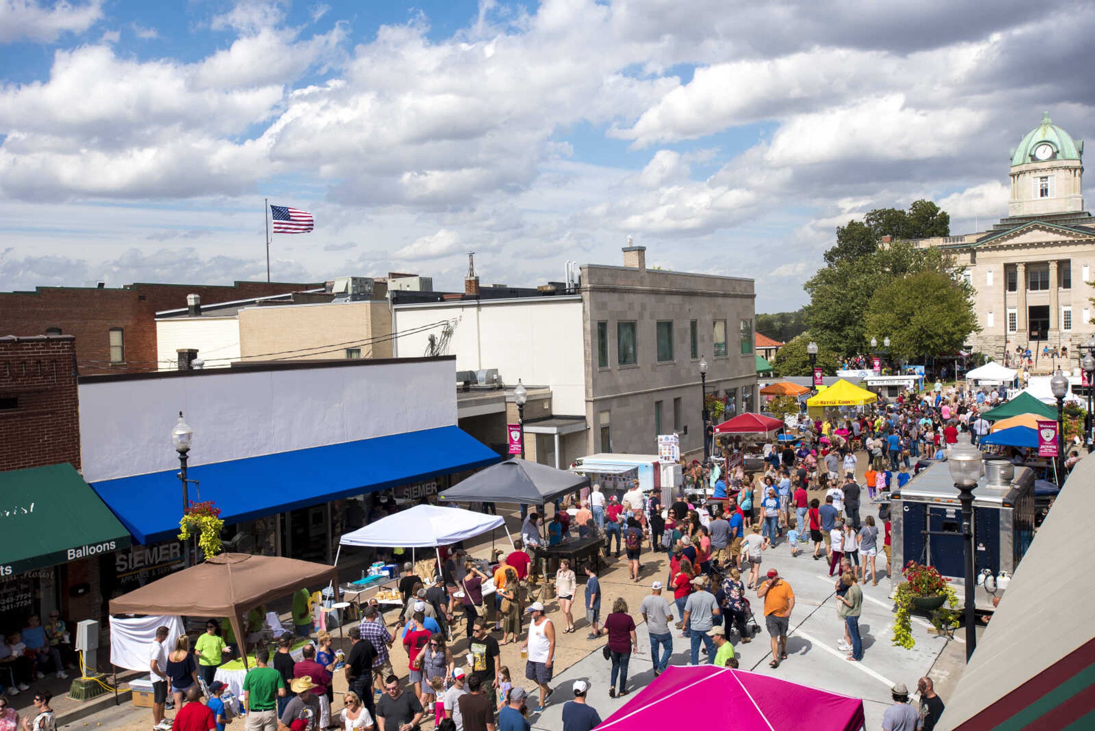 People walk around at the Uptown Jackson Oktoberfest, Saturday, October 7, 2017.