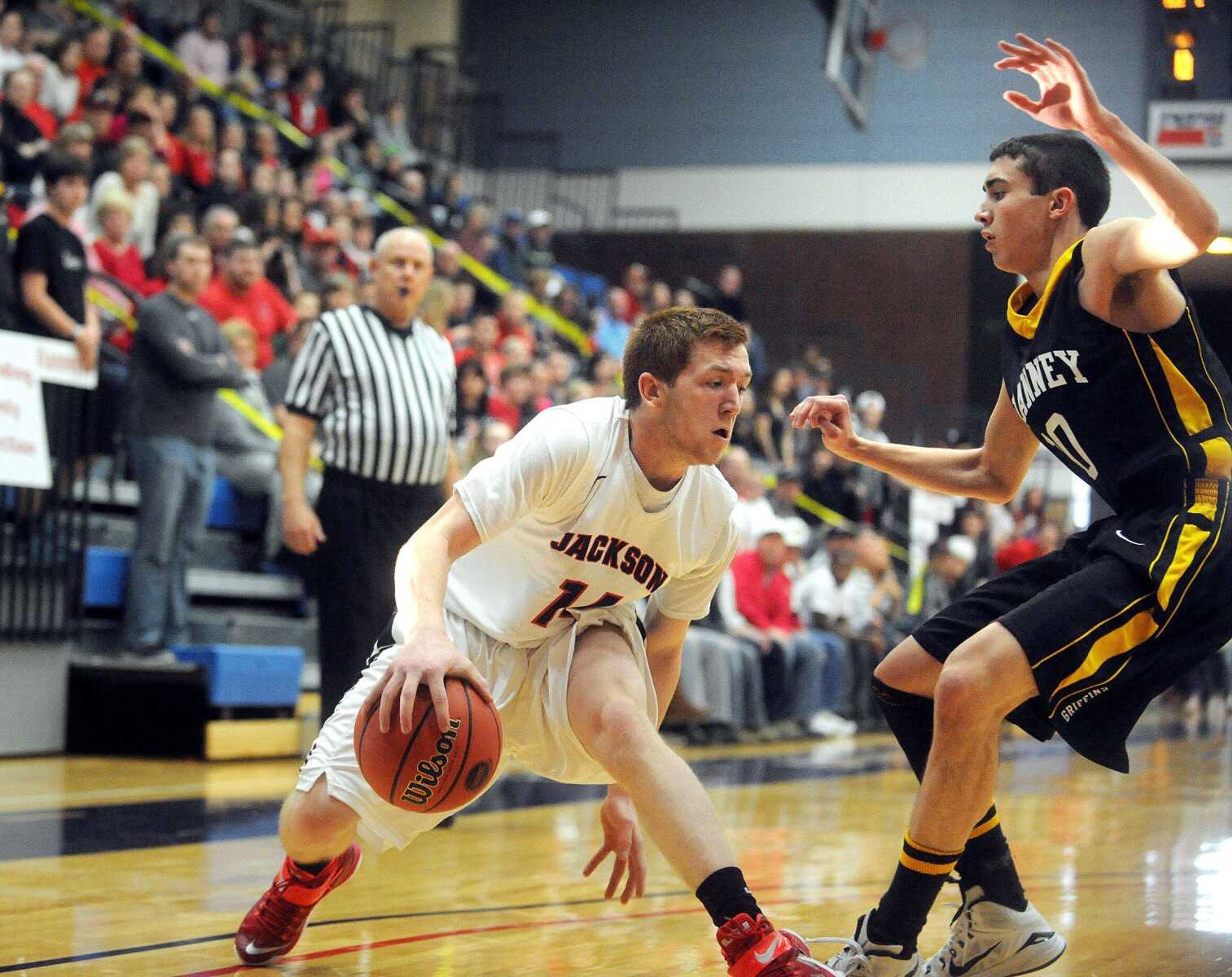 Jackson's Jacob Smith maneuvers around Vianney's Zachary Colletta in the first quarter of the Indians Class 5 sectional game against the Golden Griffins, Wednesday, March 11, 2015, in Hillsboro. Jackson won 59-57. (Laura Simon)