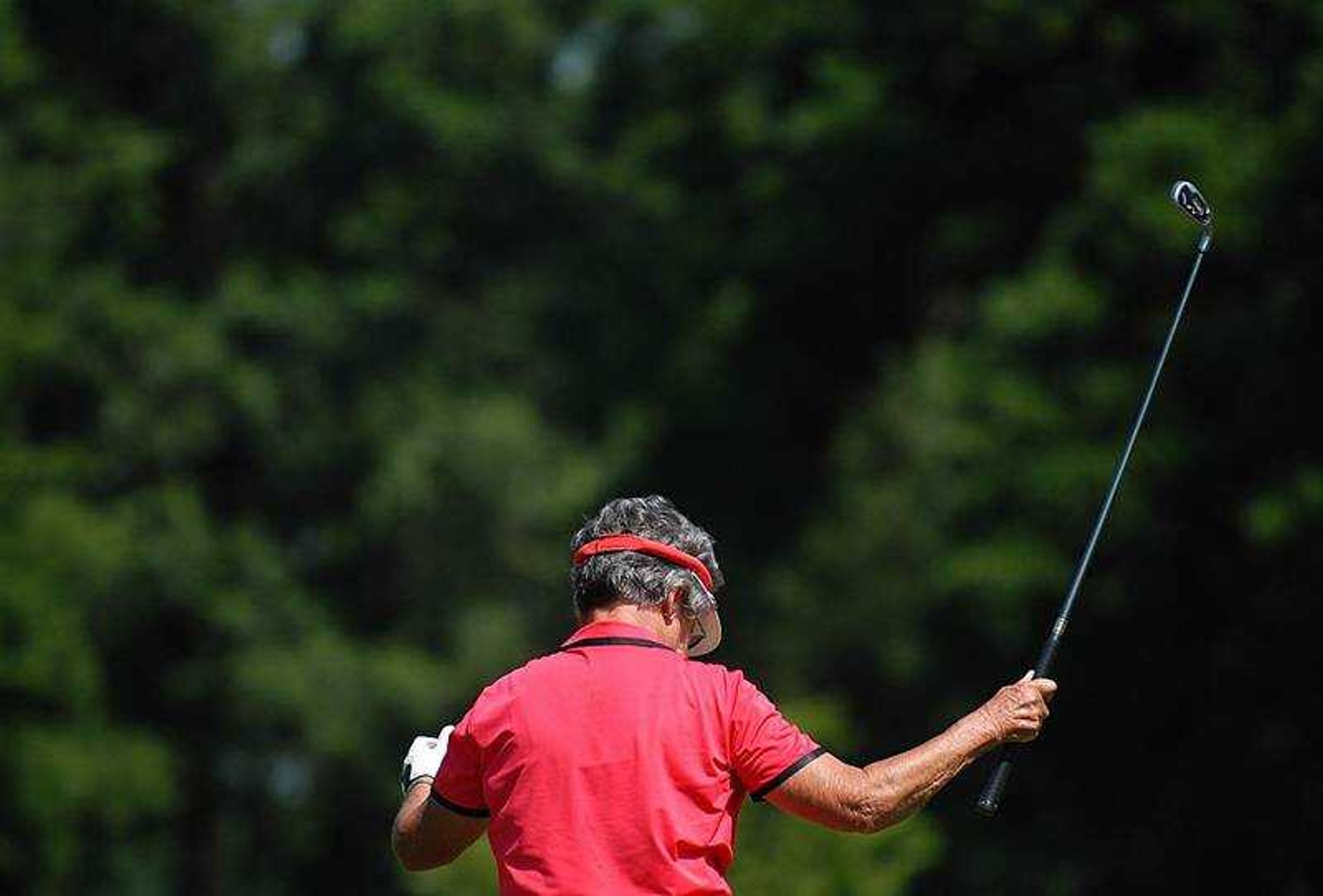 Reba Mell threw up her hands and club after driving the ball into the sand Thursday during the second round of the Lassies Classic at the Cape Girardeau Country Club.