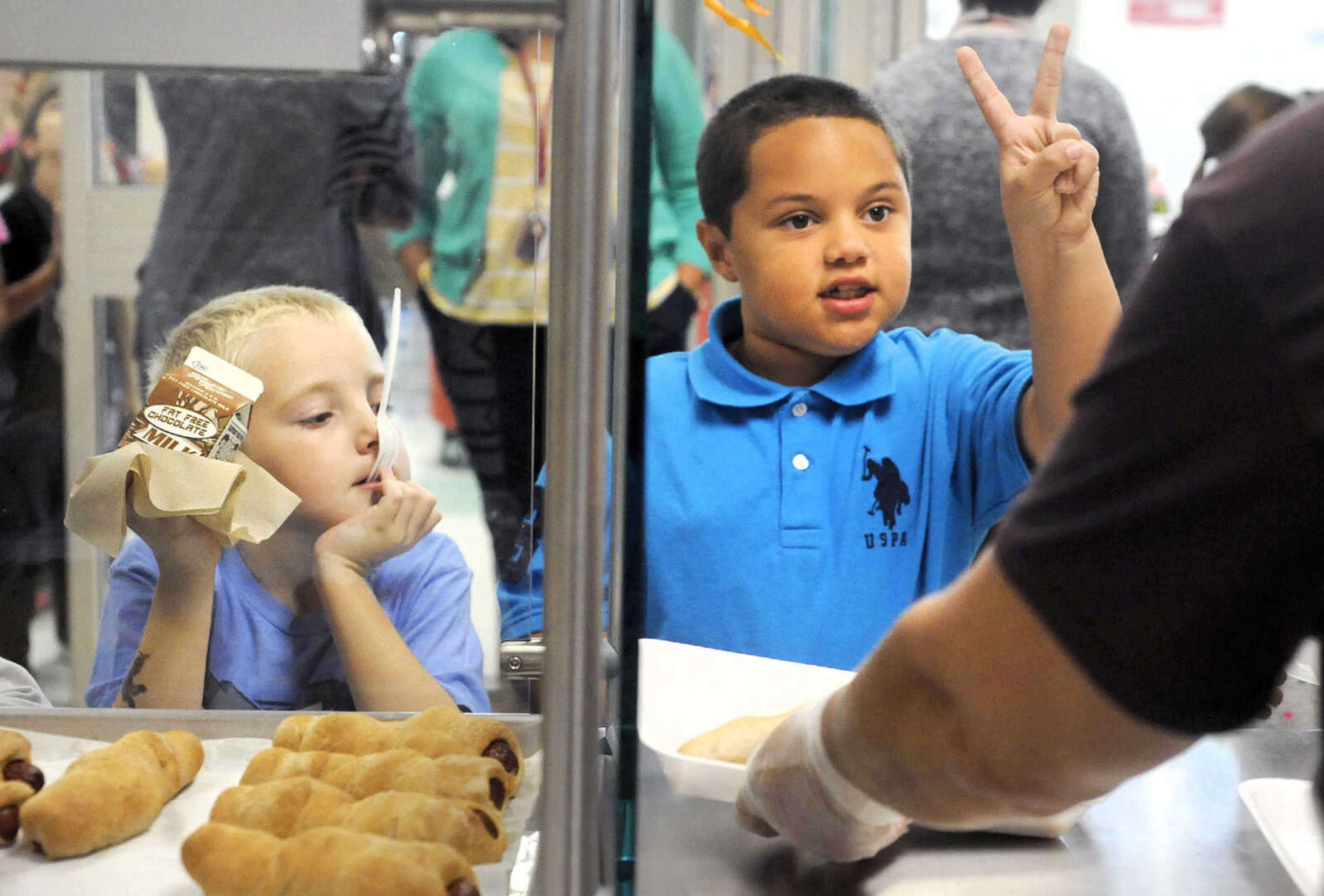 LAURA SIMON ~ lsimon@semissourian.com

Decimus Gill, left, and Jaelen Shores, pickup their lunch trays, Tuesday, Oct. 13, 2015, at East Elementary in Jackson.